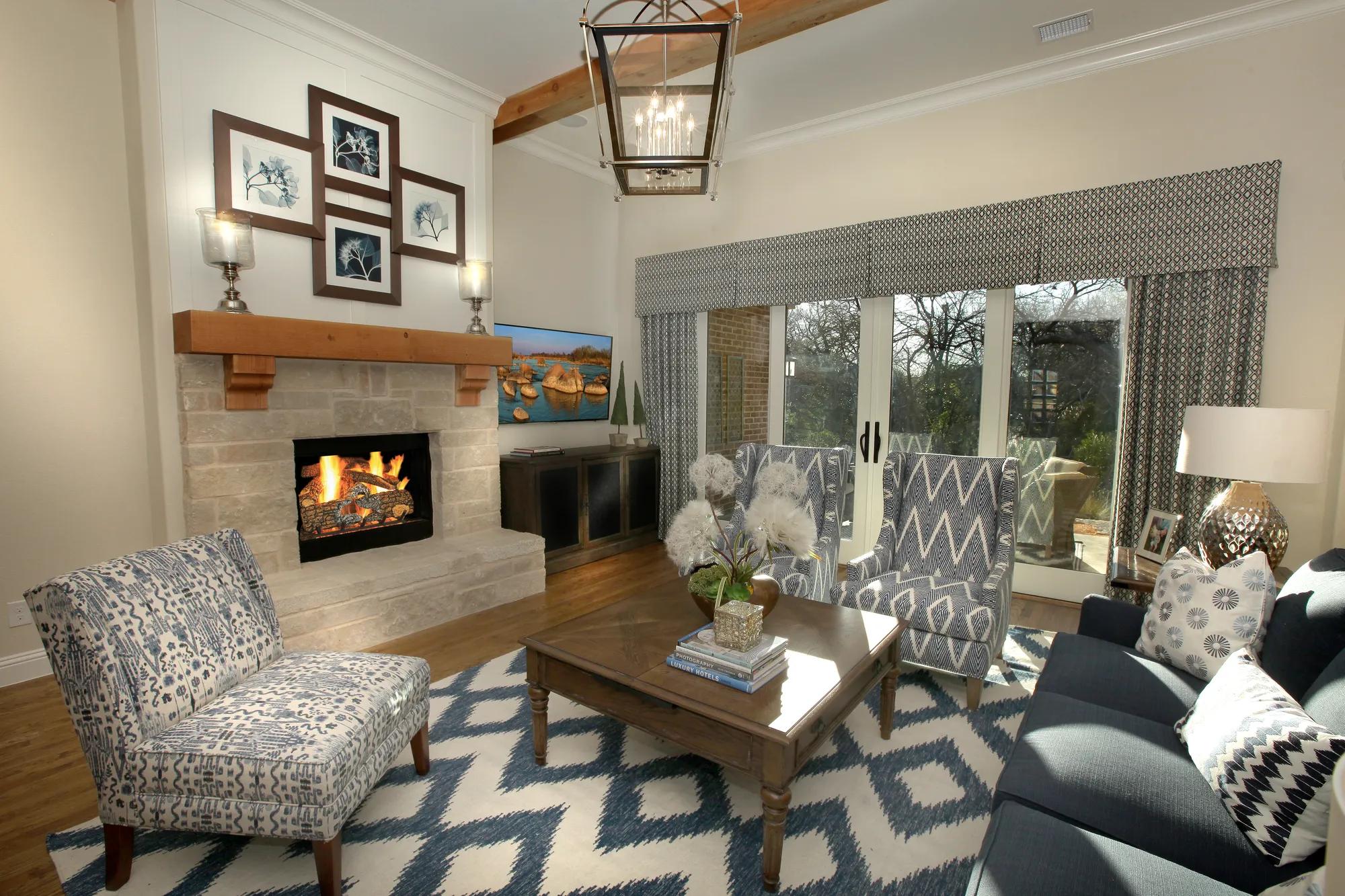 family room with stone fireplace and hardwood floor