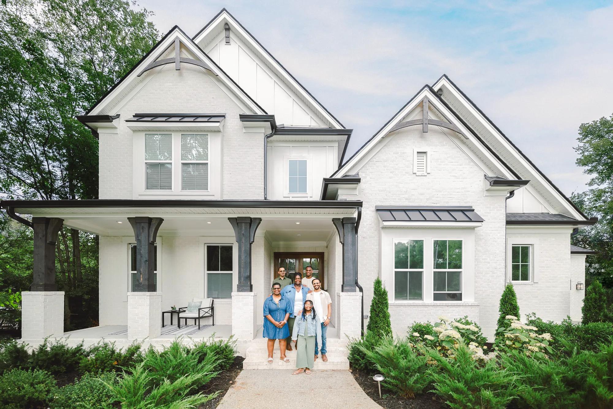 New homeowners in front of their Drees Home