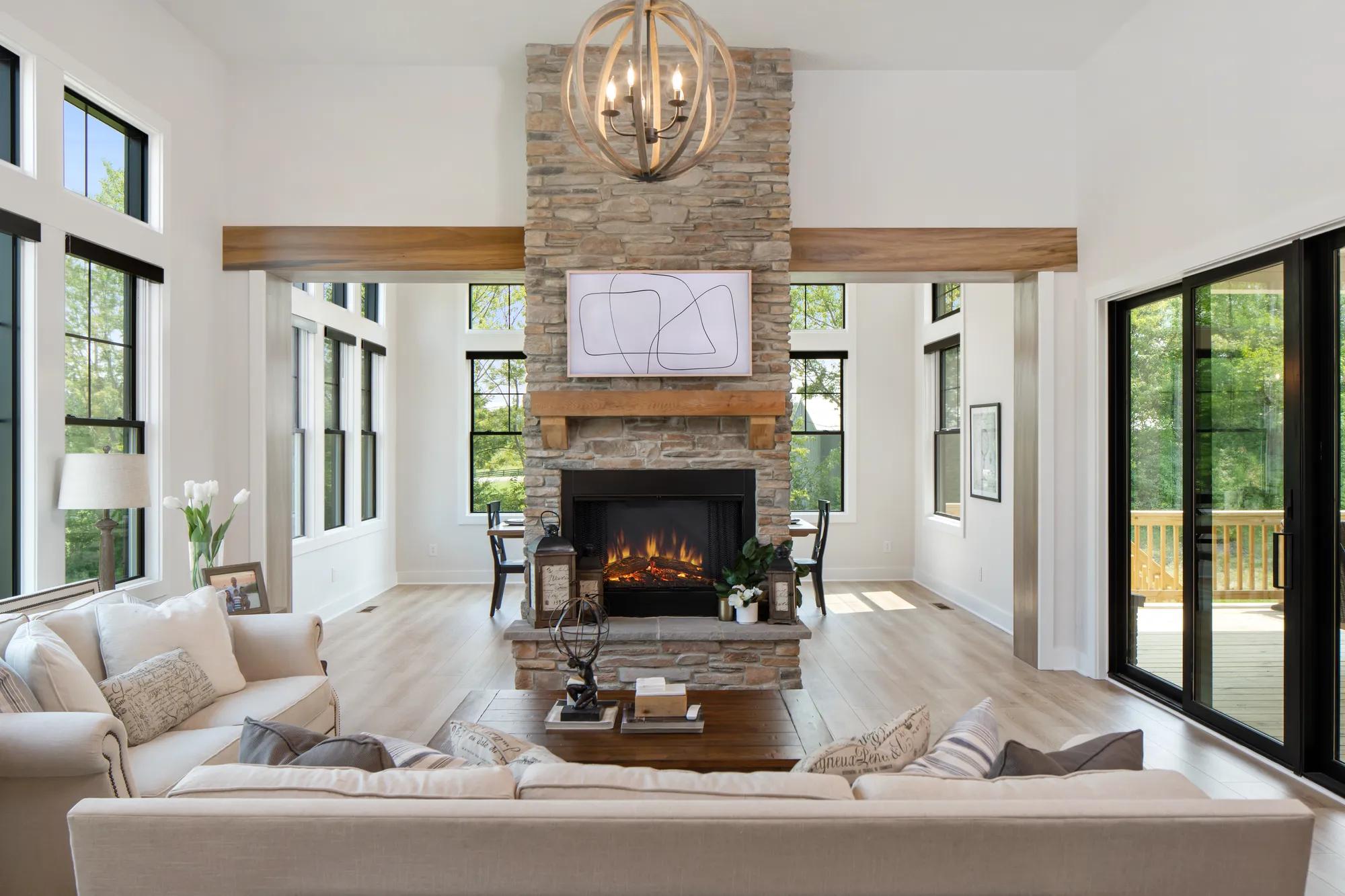 Beautiful family room accompanied by the stone fireplace