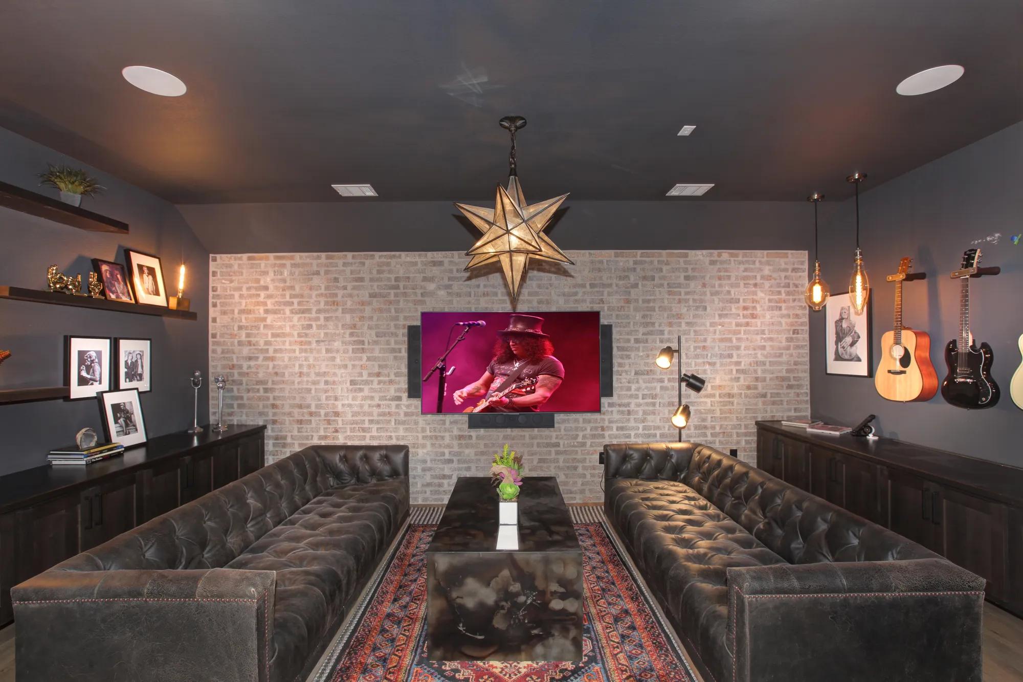 Media room with brick accent wall