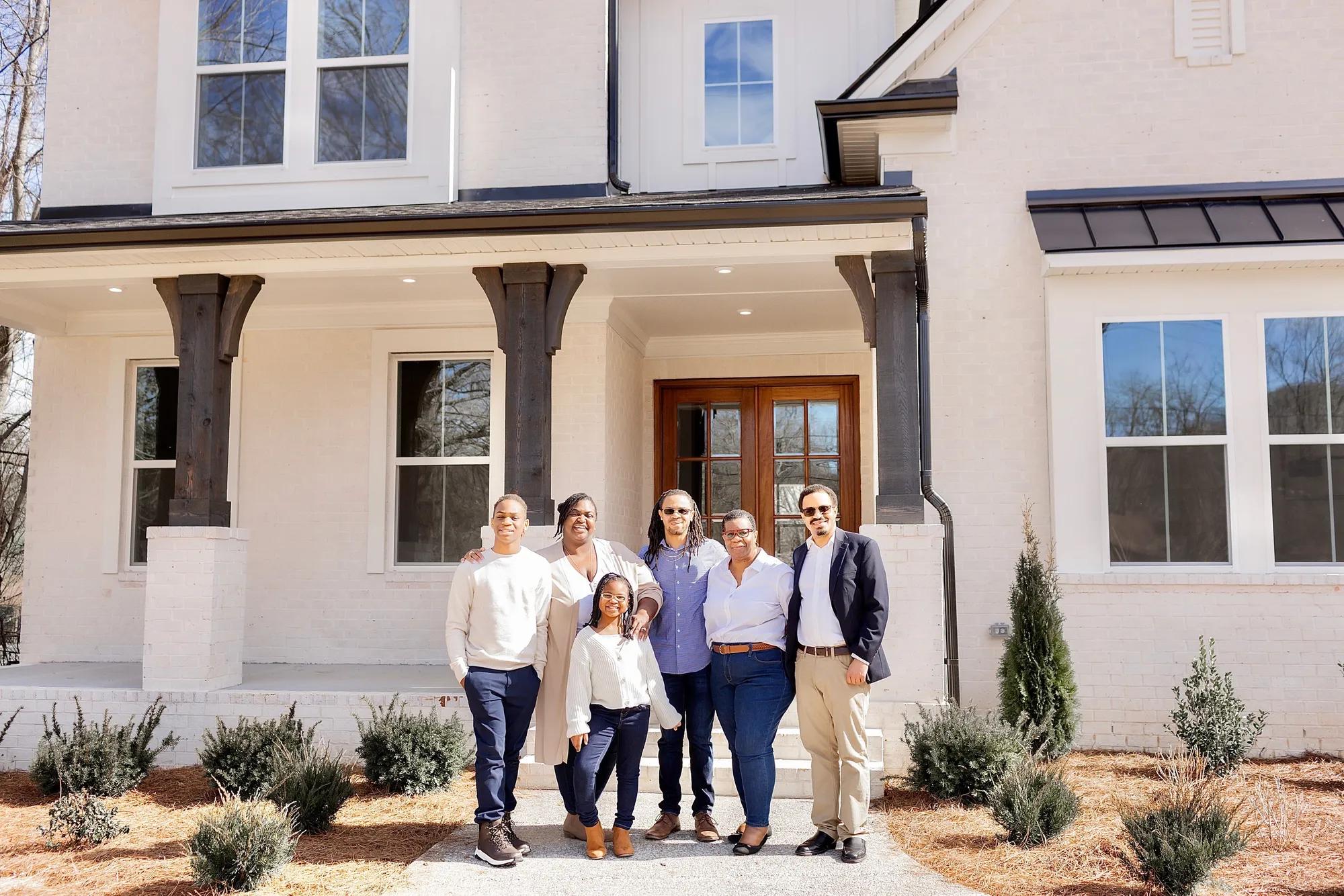 New homeowners in front of their Drees Home