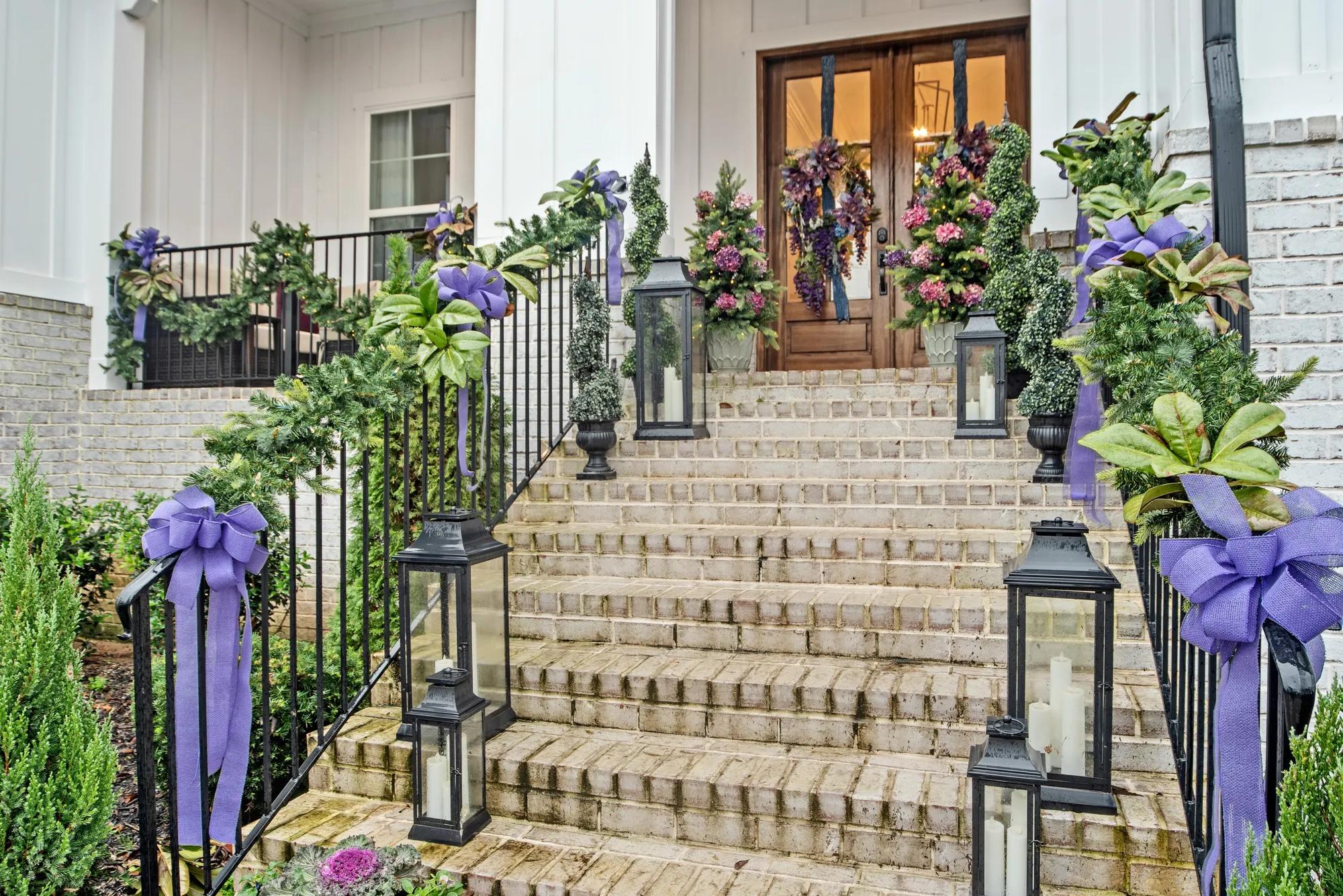 Drees custom home with holiday garlands on front porch
