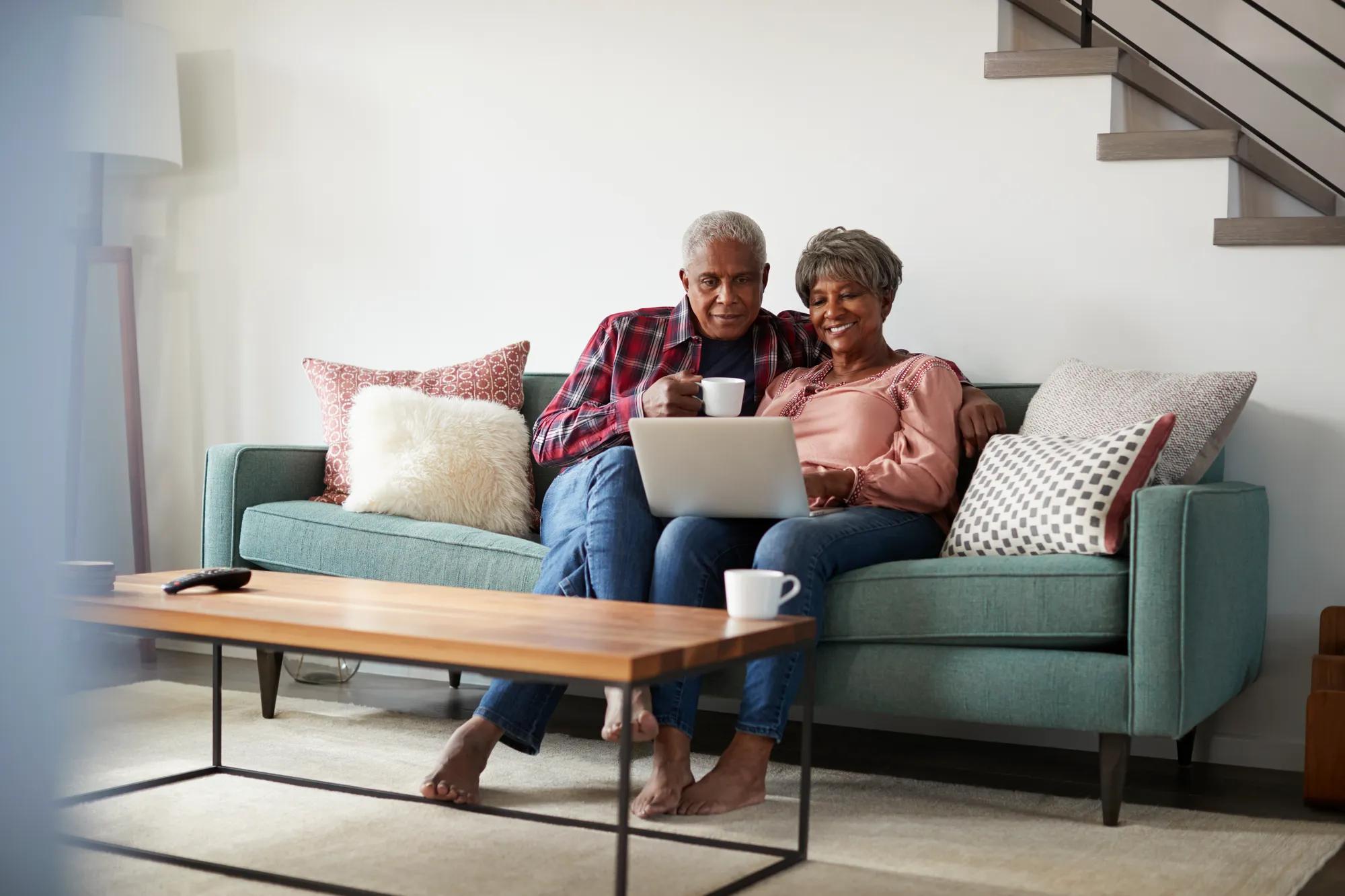 Couple on laptop at home