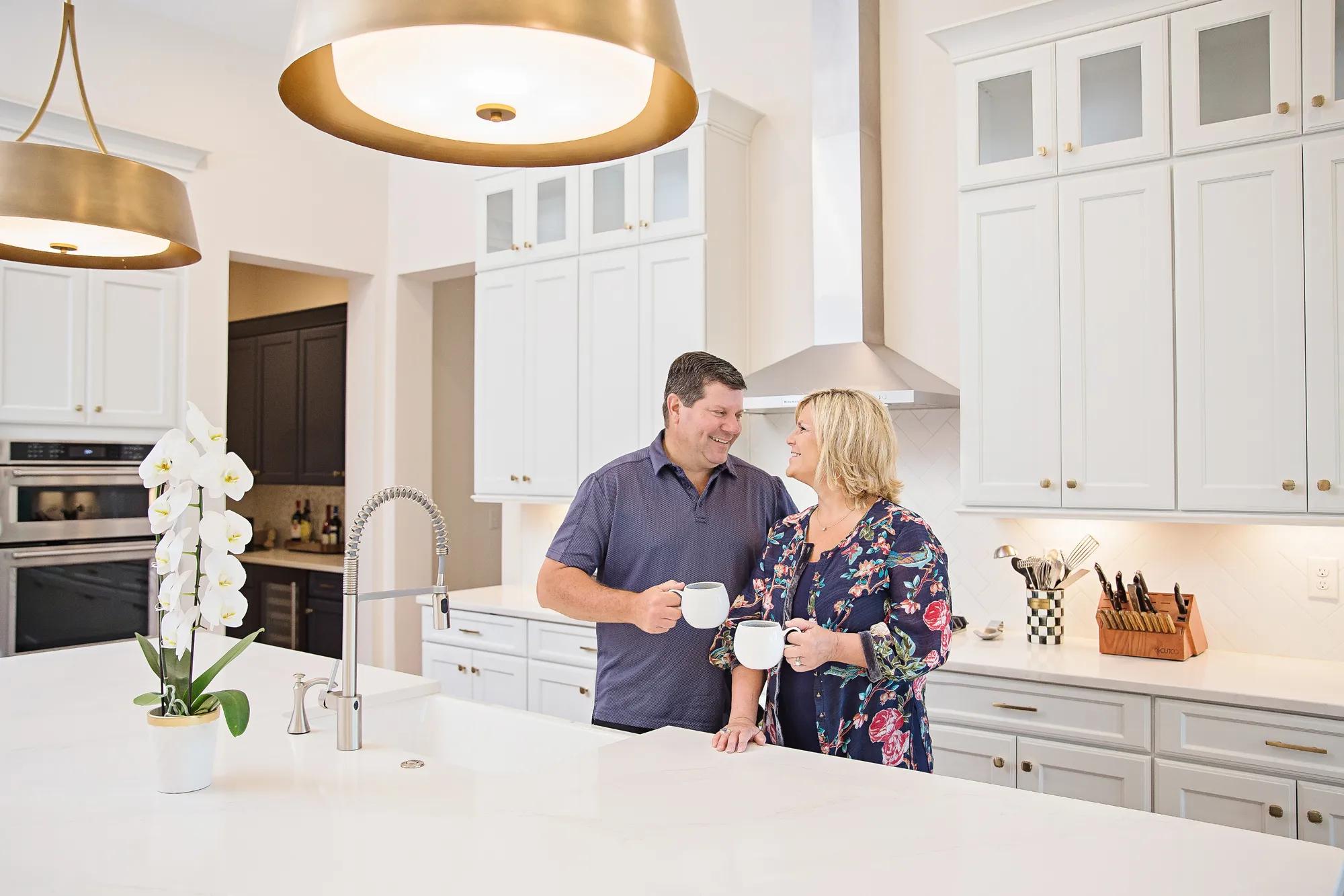 New homeowners enjoying their beautiful kitchen