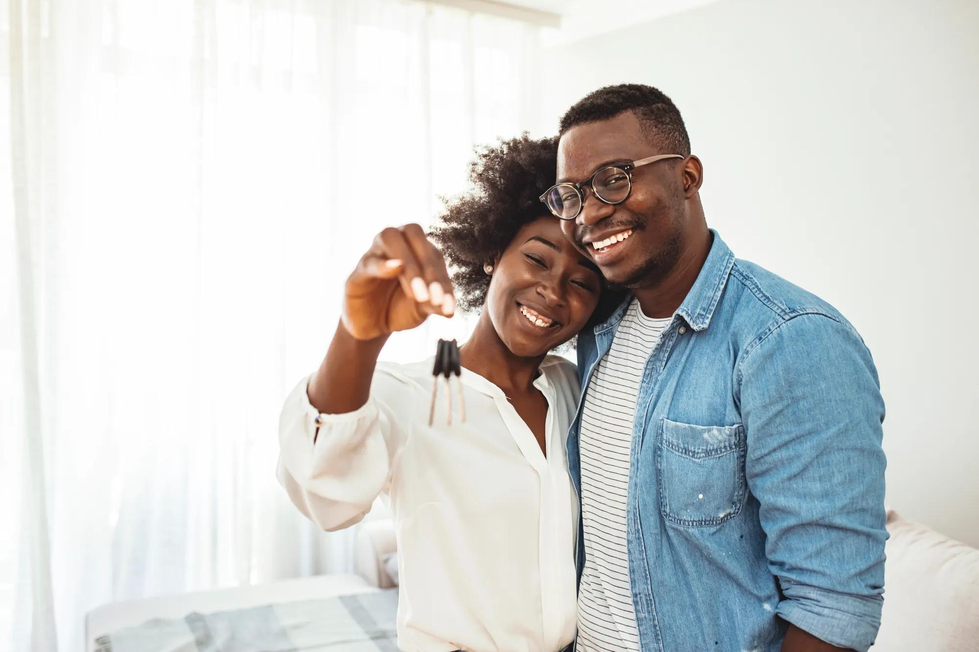 Couple holding house keys