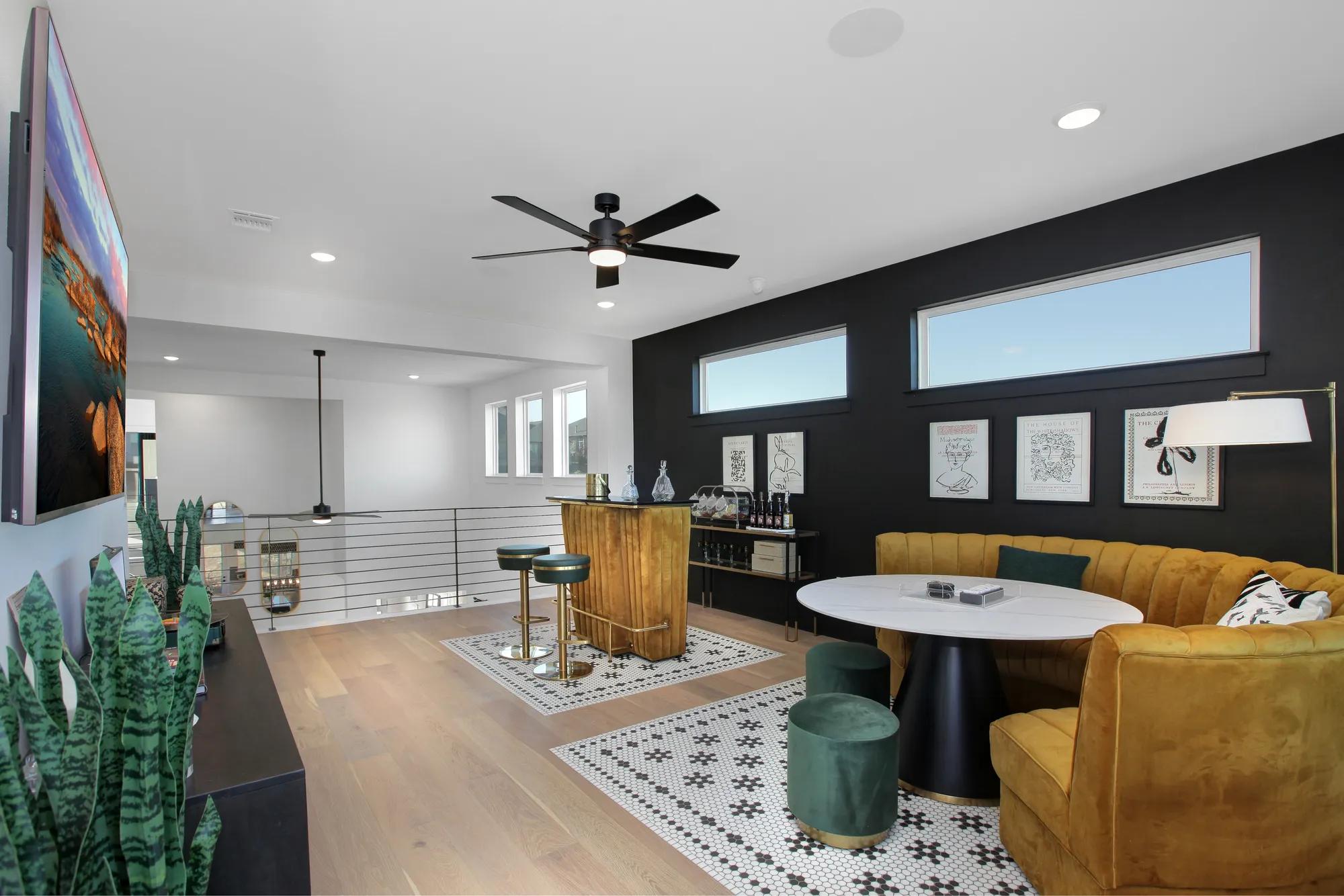 custom home gameroom with bar and sitting area