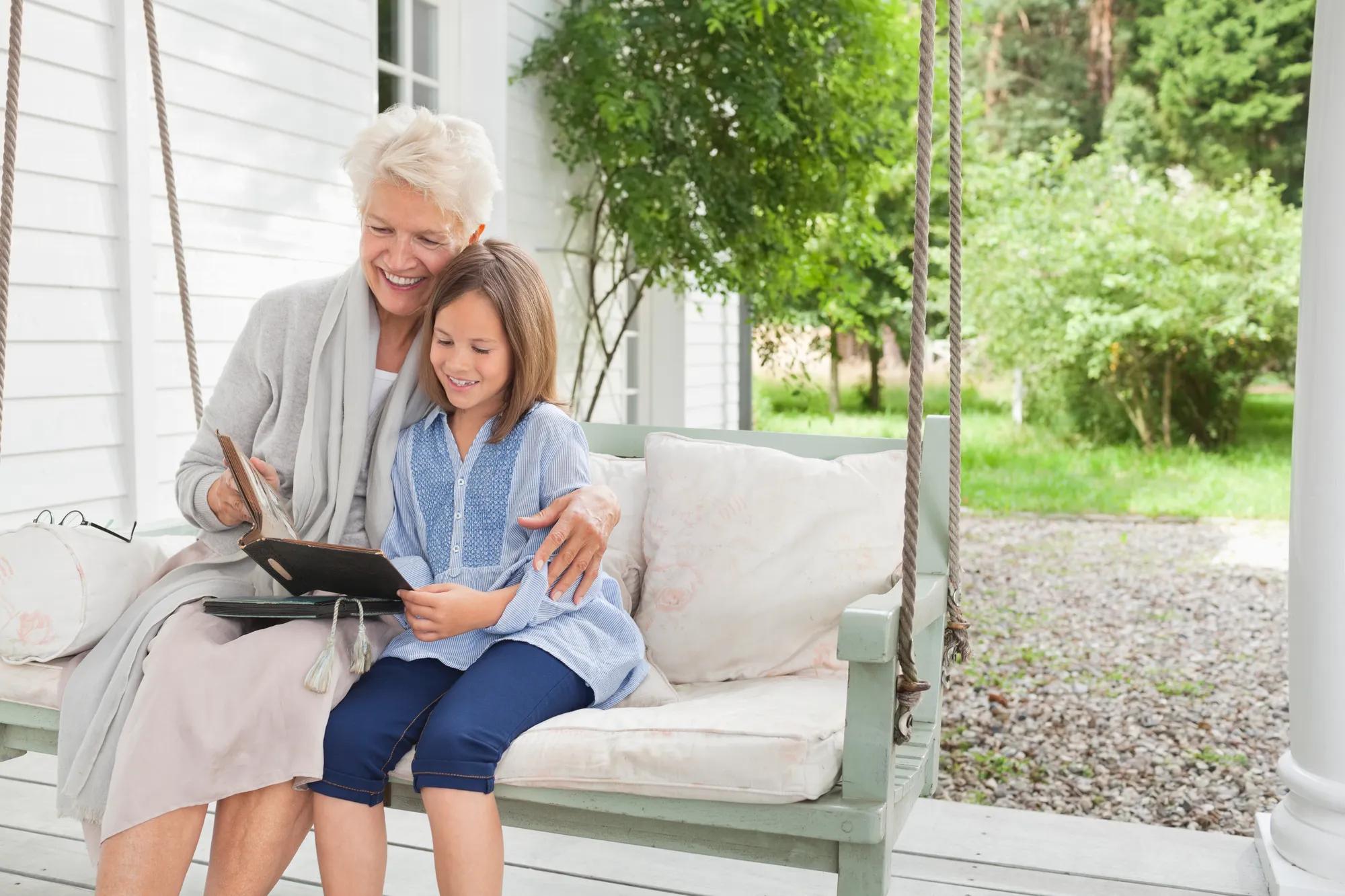 Grandmother and granddaughter enjoying new home front porch