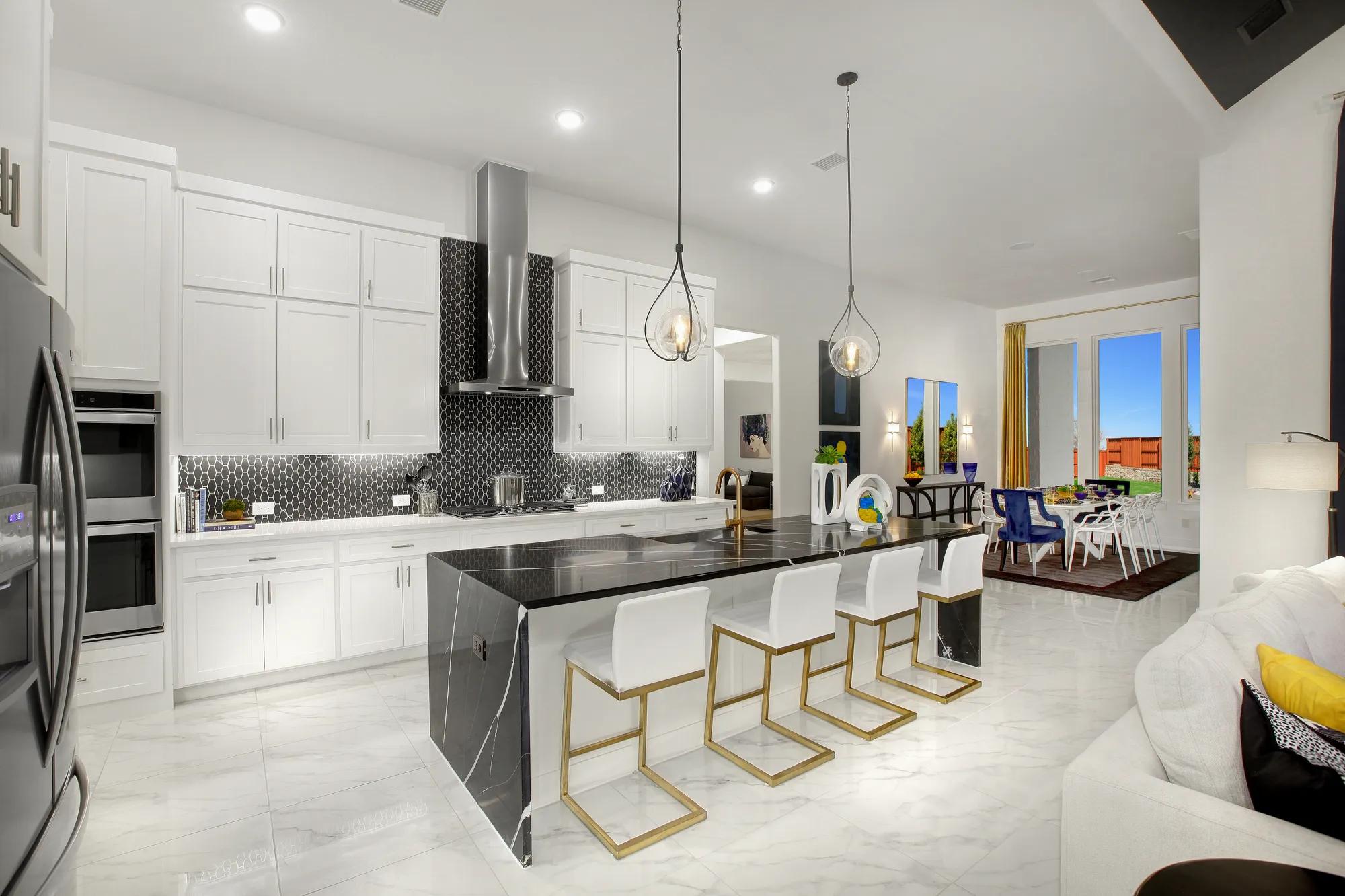kitchen with white cabinets and black quartz counters