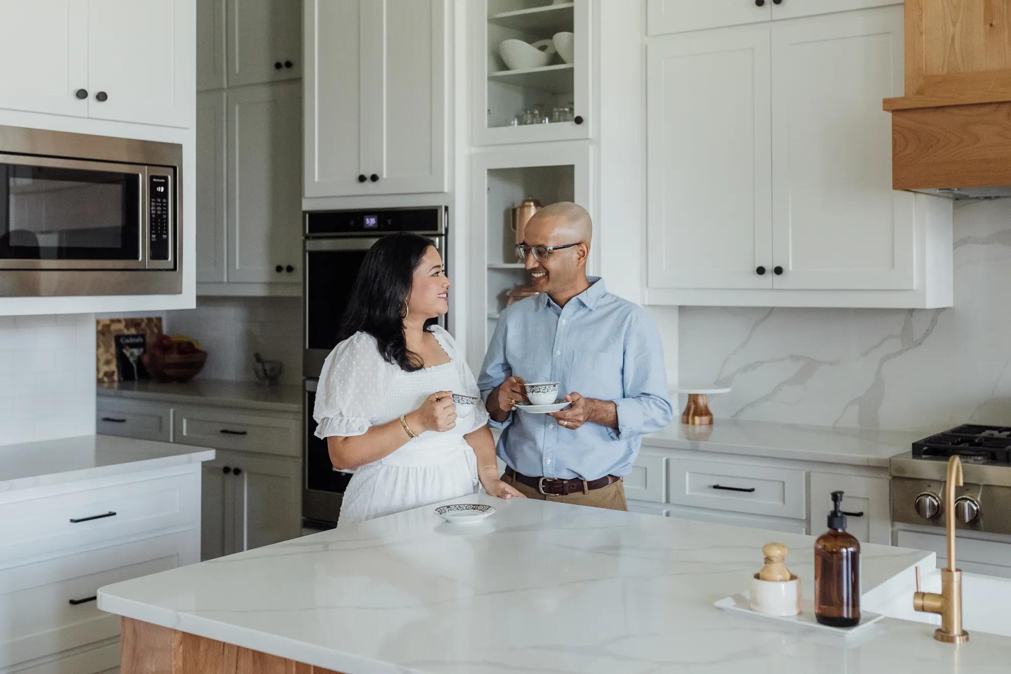 new Drees homeowners stand in new custom home