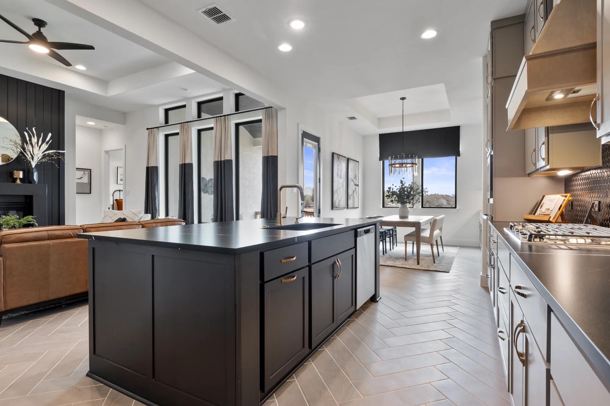 Custom home open floor plan kitchen, dining, and living room