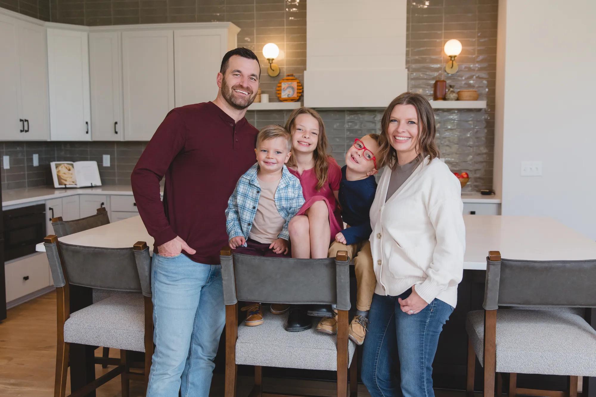 New homeowners enjoying their new Drees Home kitchen