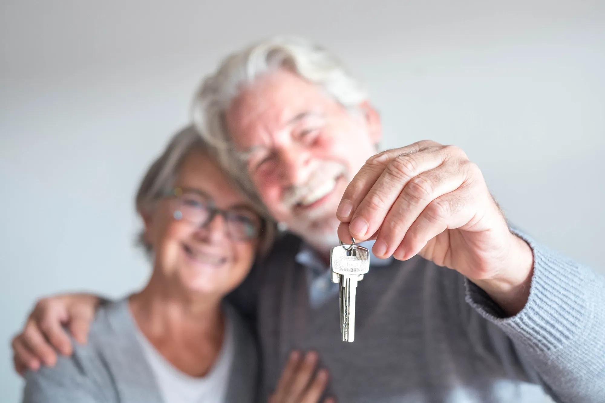 Couple holding house keys