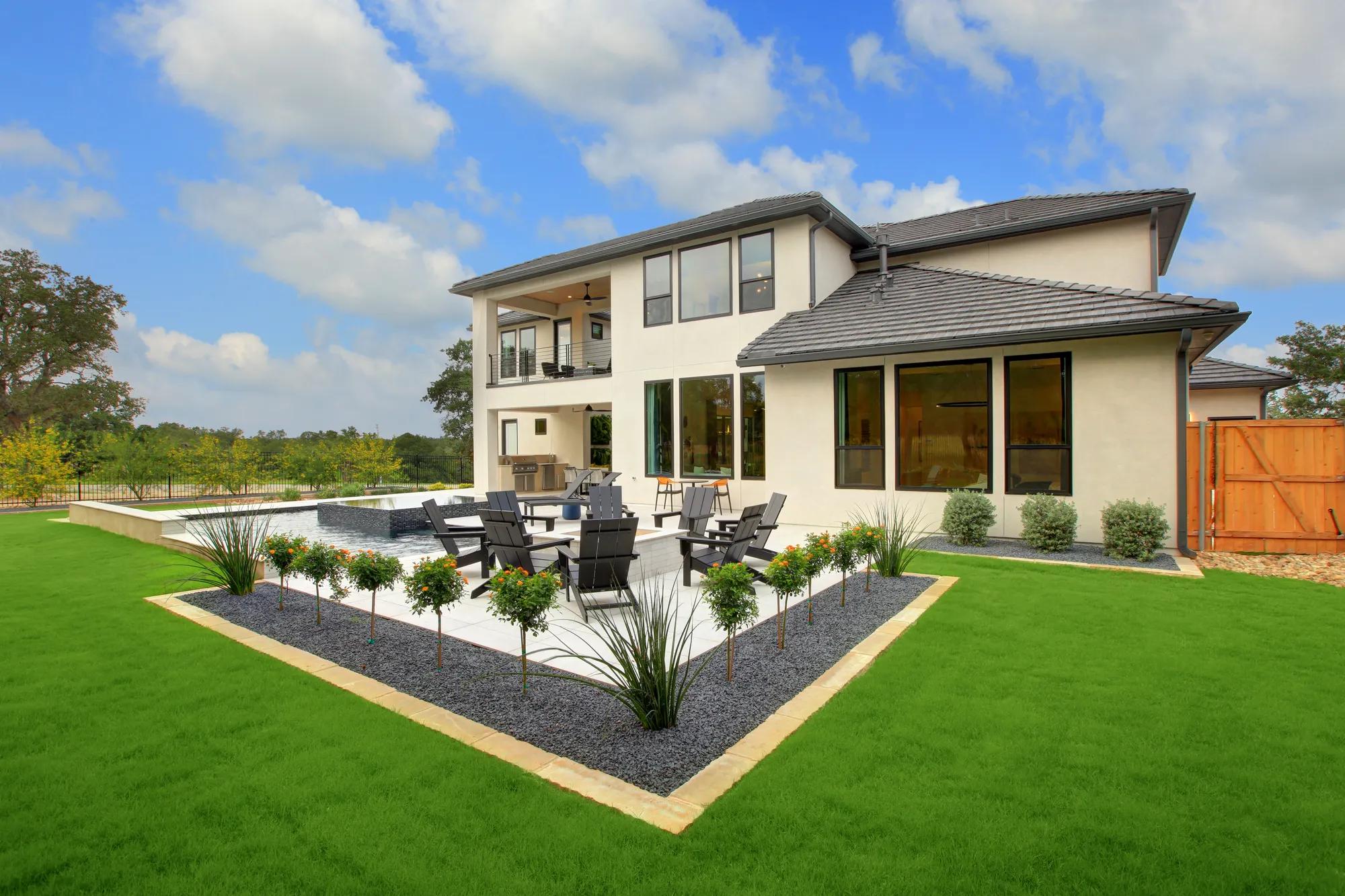 new Drees home rear exterior with firepit and pool