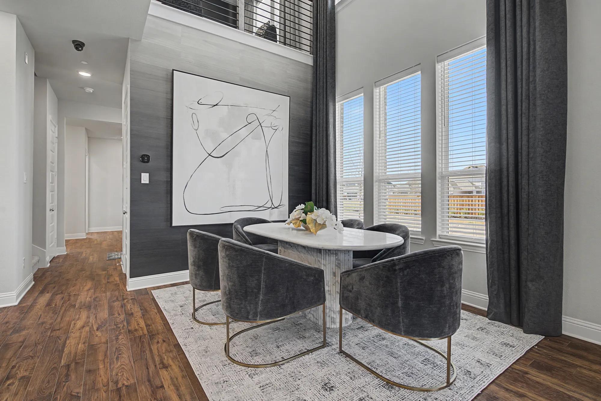 New townhome two-story dining room with wallpaper accent wall