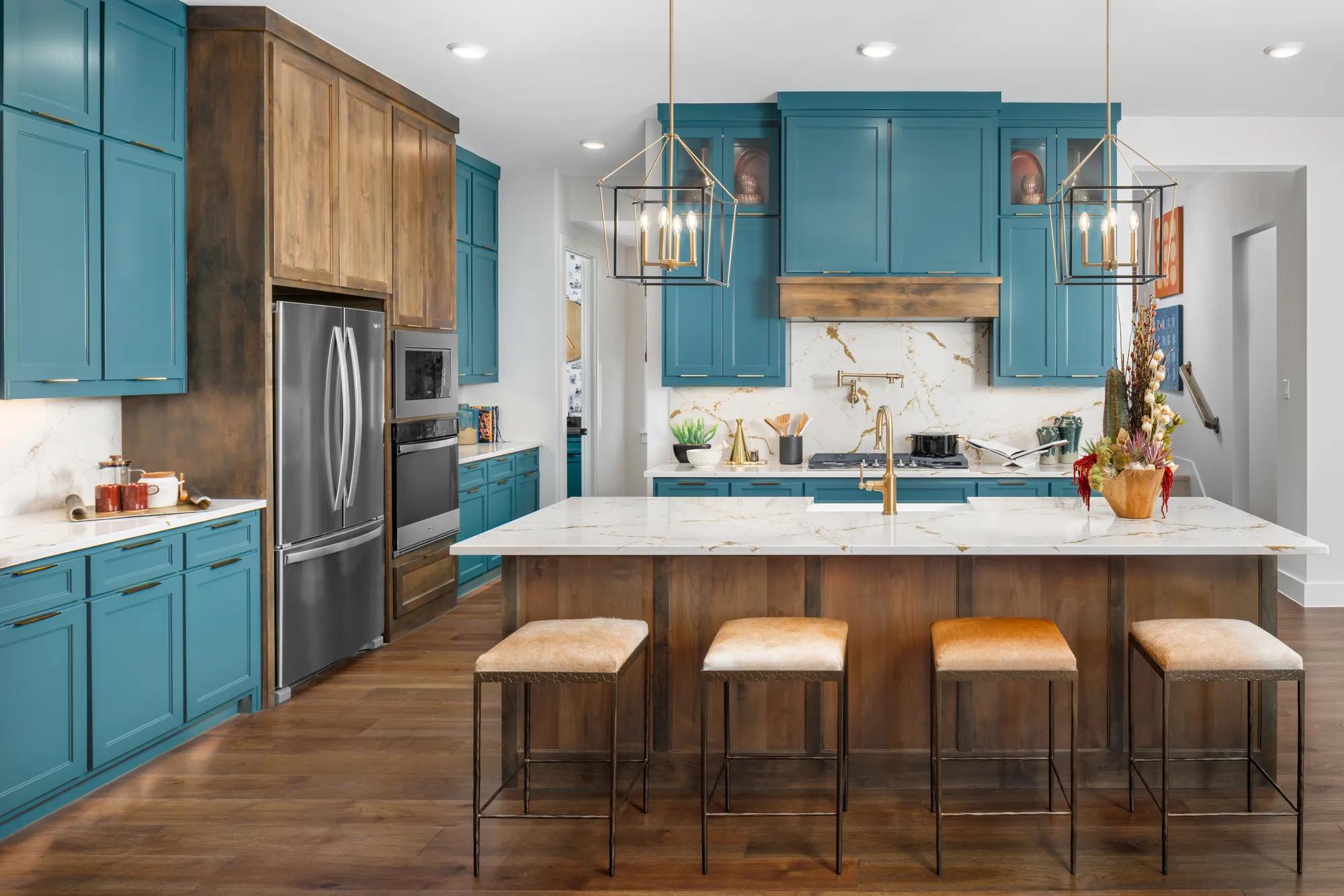 Texas modern home kitchen with gold finishes, blue cabinets, and rich wood accents