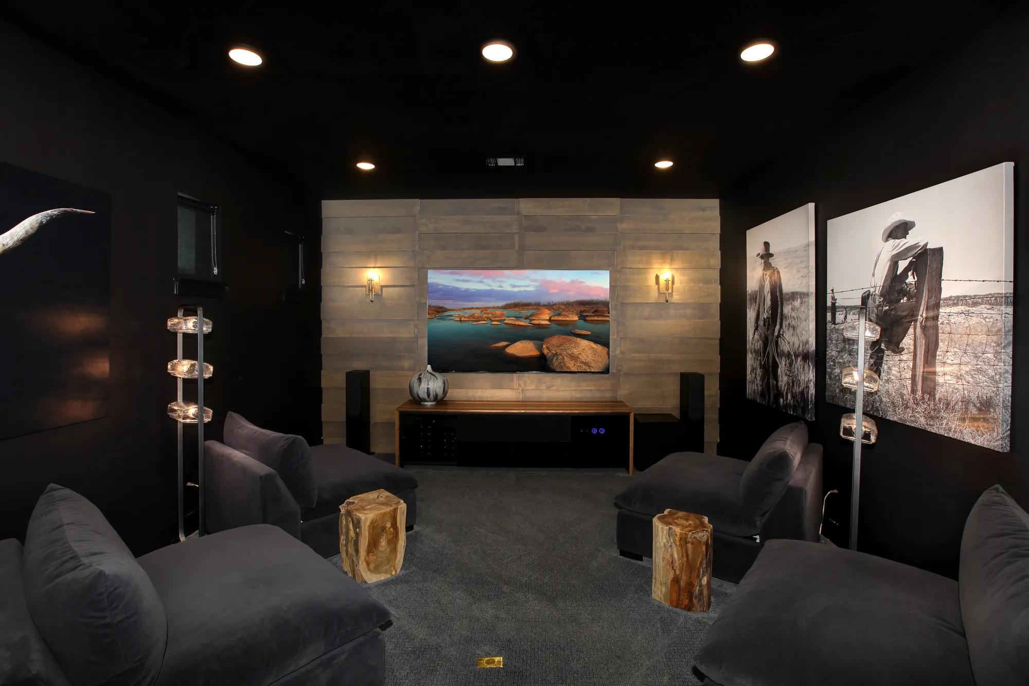 media room with dark walls
