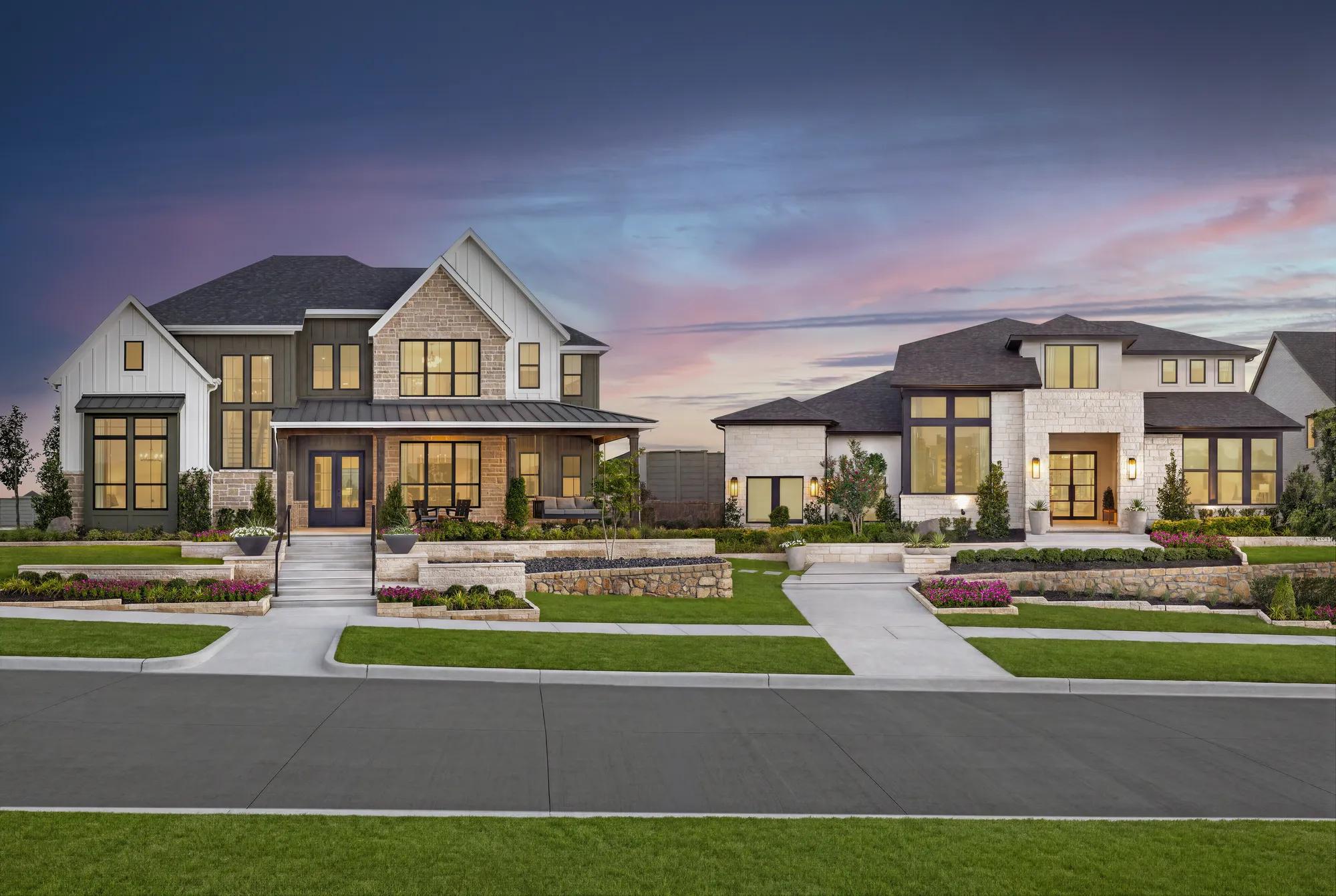 Street view of two new model homes at Landmark by Drees Custom Homes