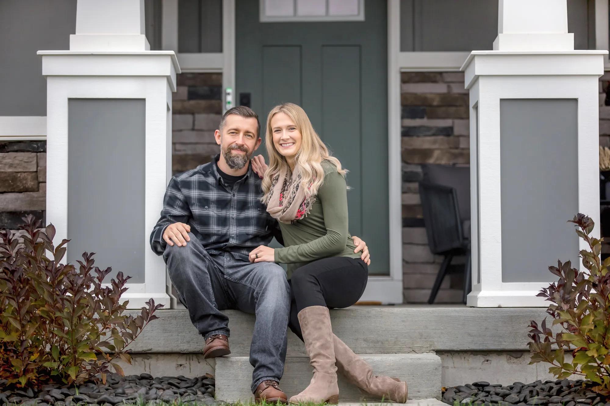 New homeowners enjoying a beautiful day from their Drees Home front porch