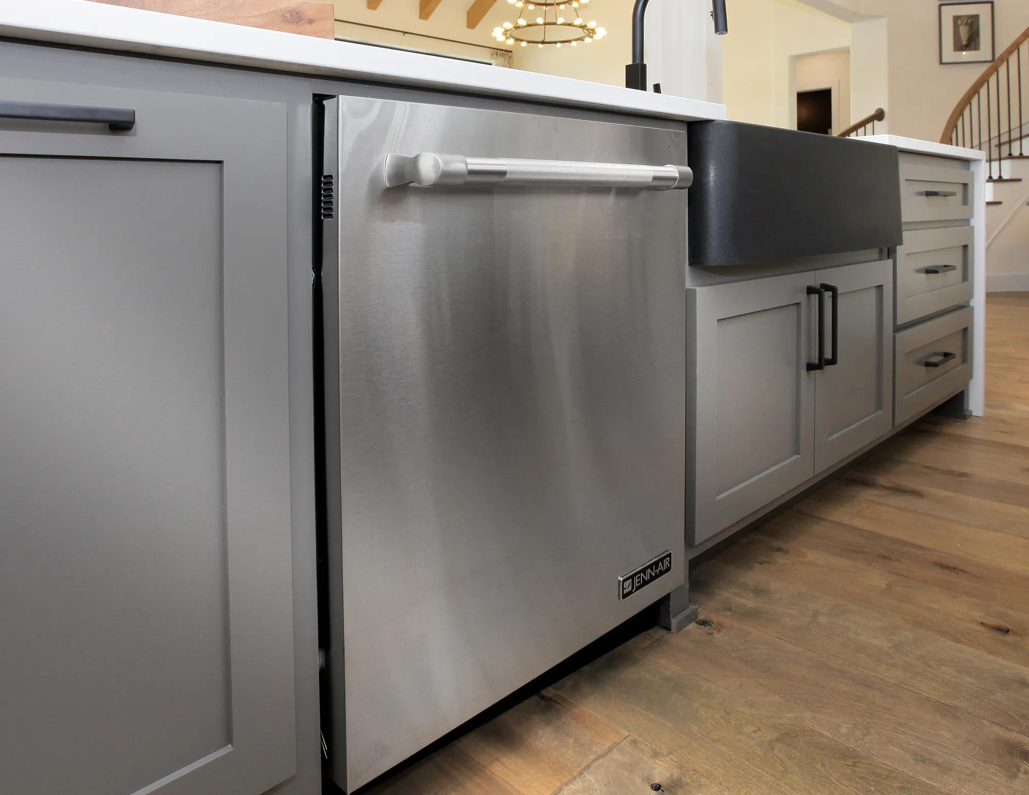 Kitchen island with stainless steel dishwasher