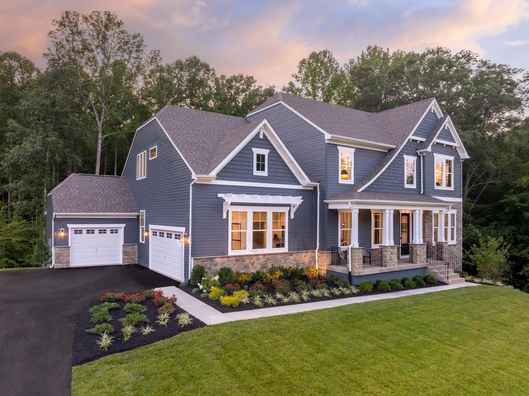 new construction home with stone and siding