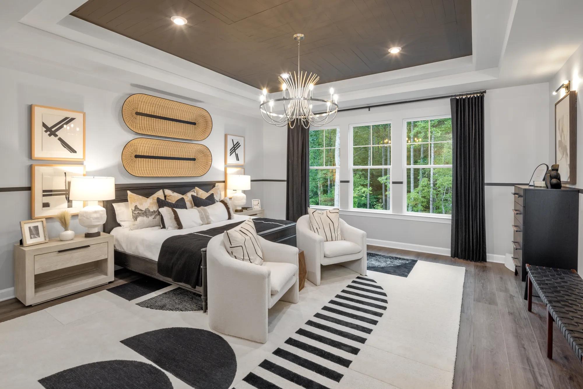 custom home primary suite with large windows