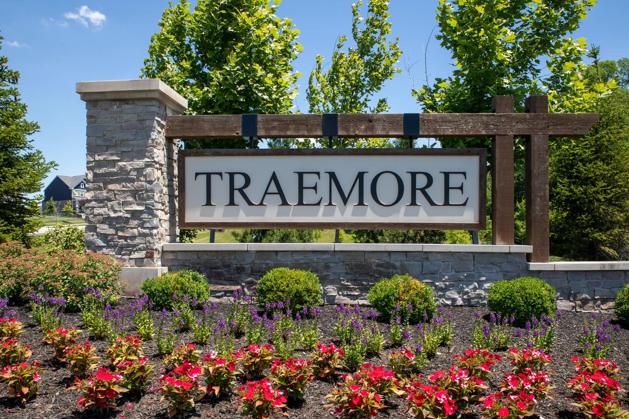community entrance with wood and stone monument