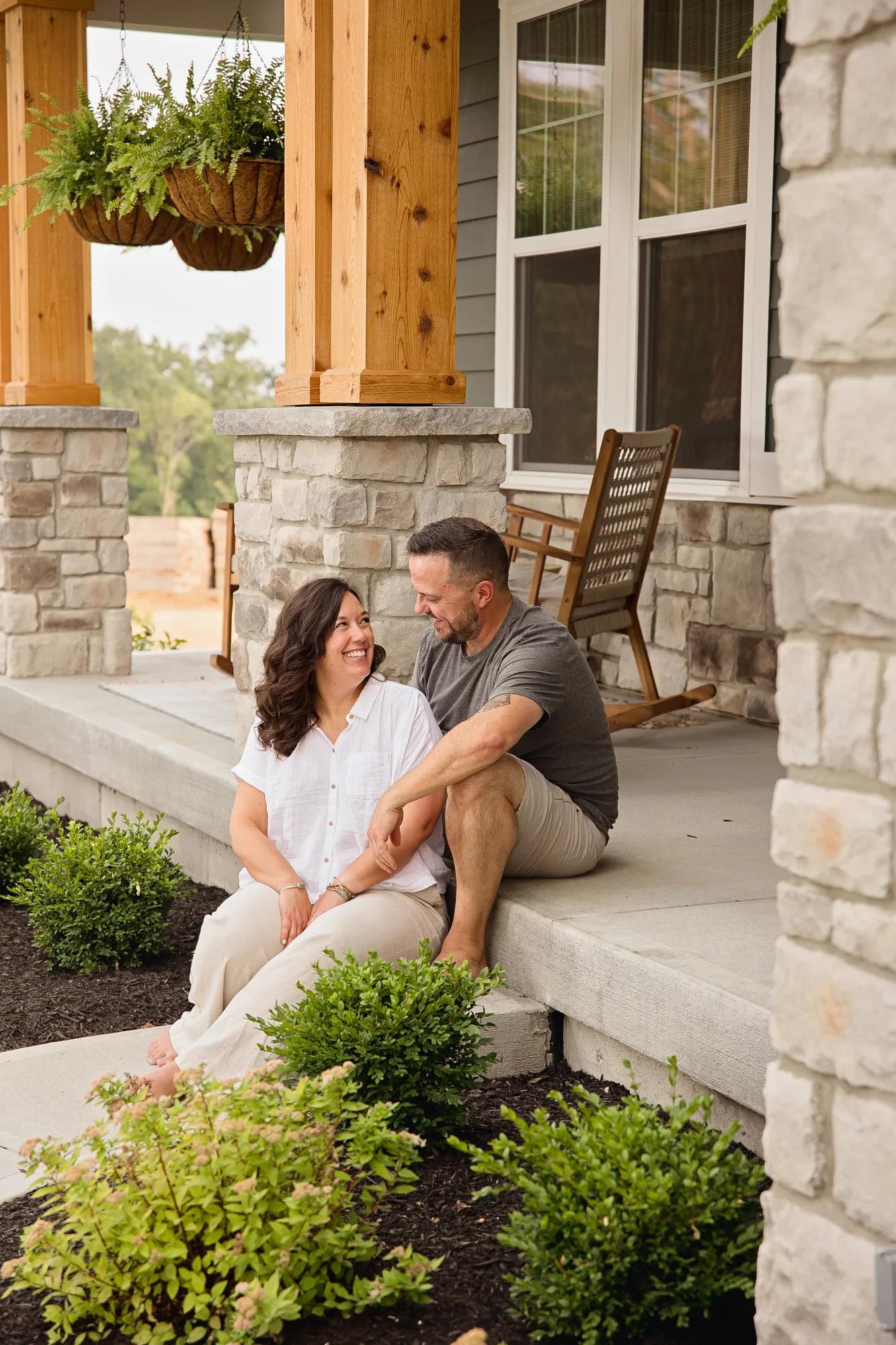 New homeowners outside of their Alden home