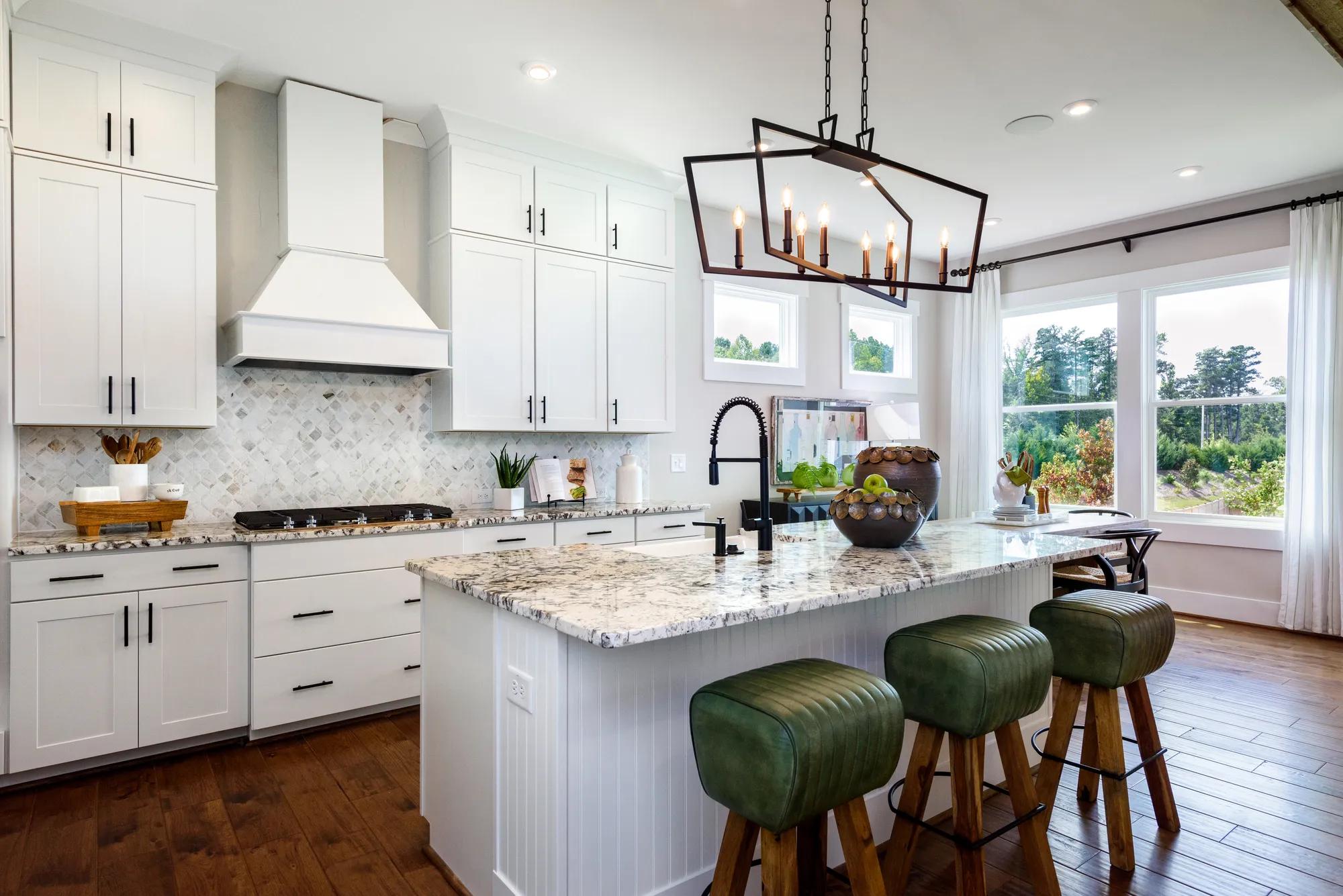 kitchen with white cabinets and large island