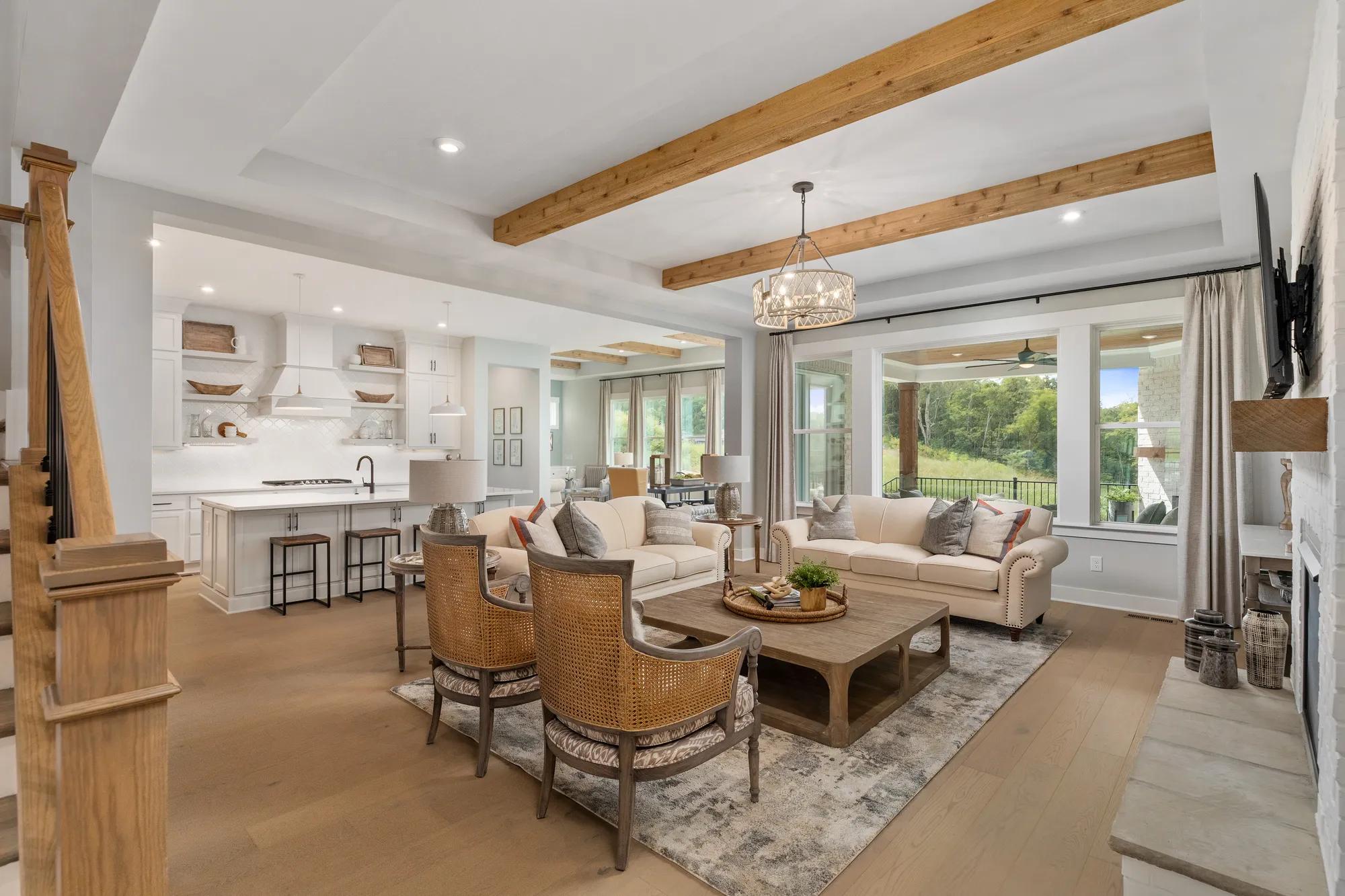 family room with wooden beam ceiling