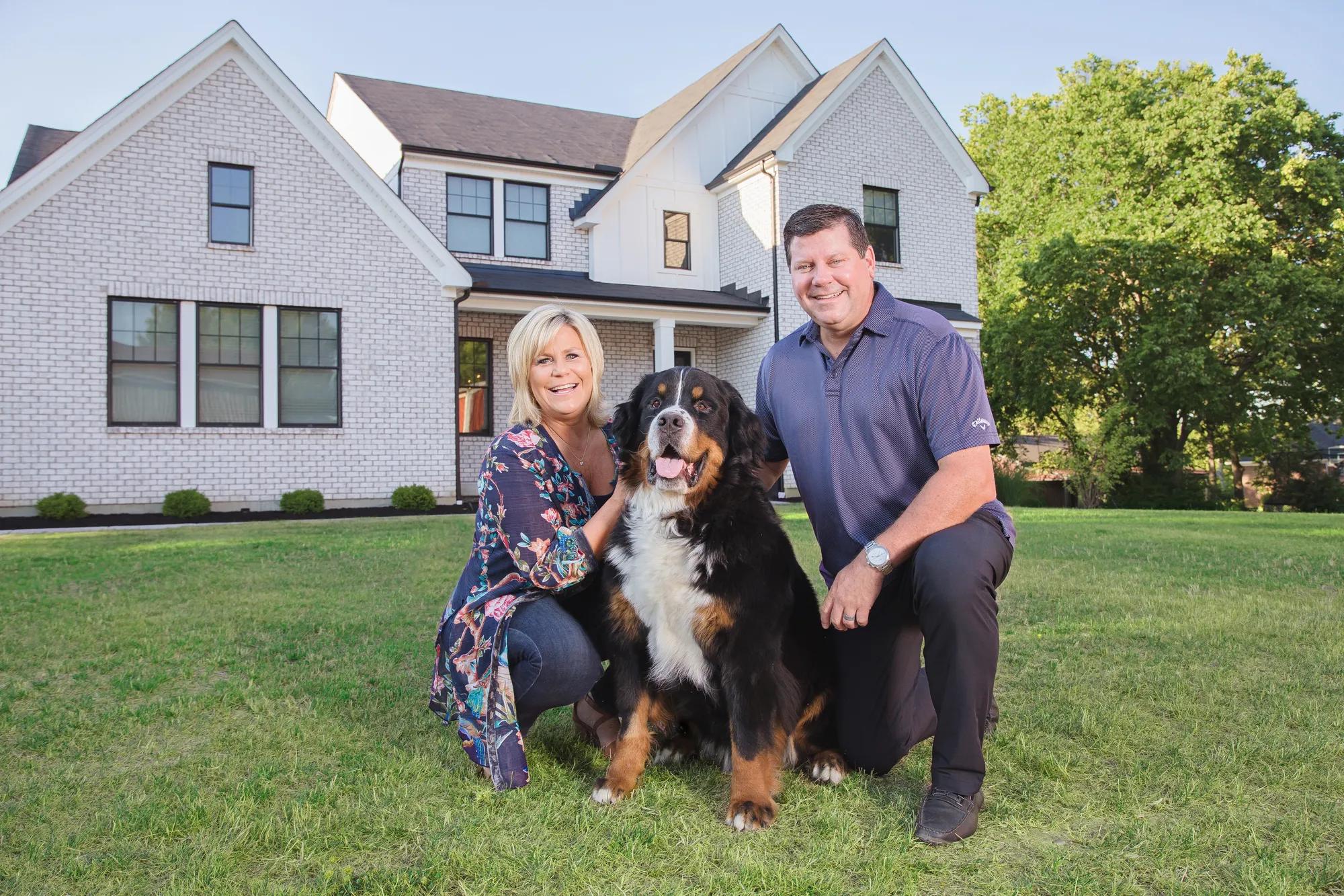 New homeowners enjoying the spacious front yard of their new Drees Home