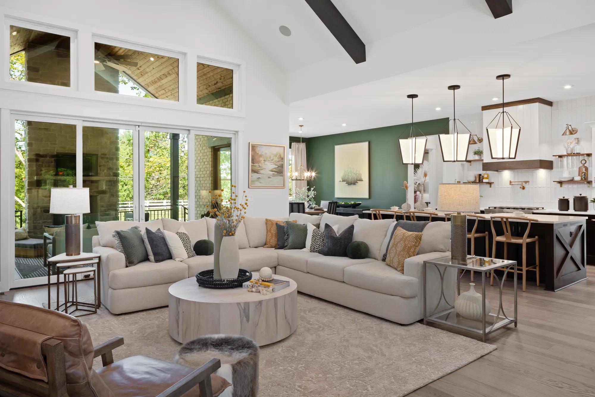family room with vaulted ceiling and wall of windows