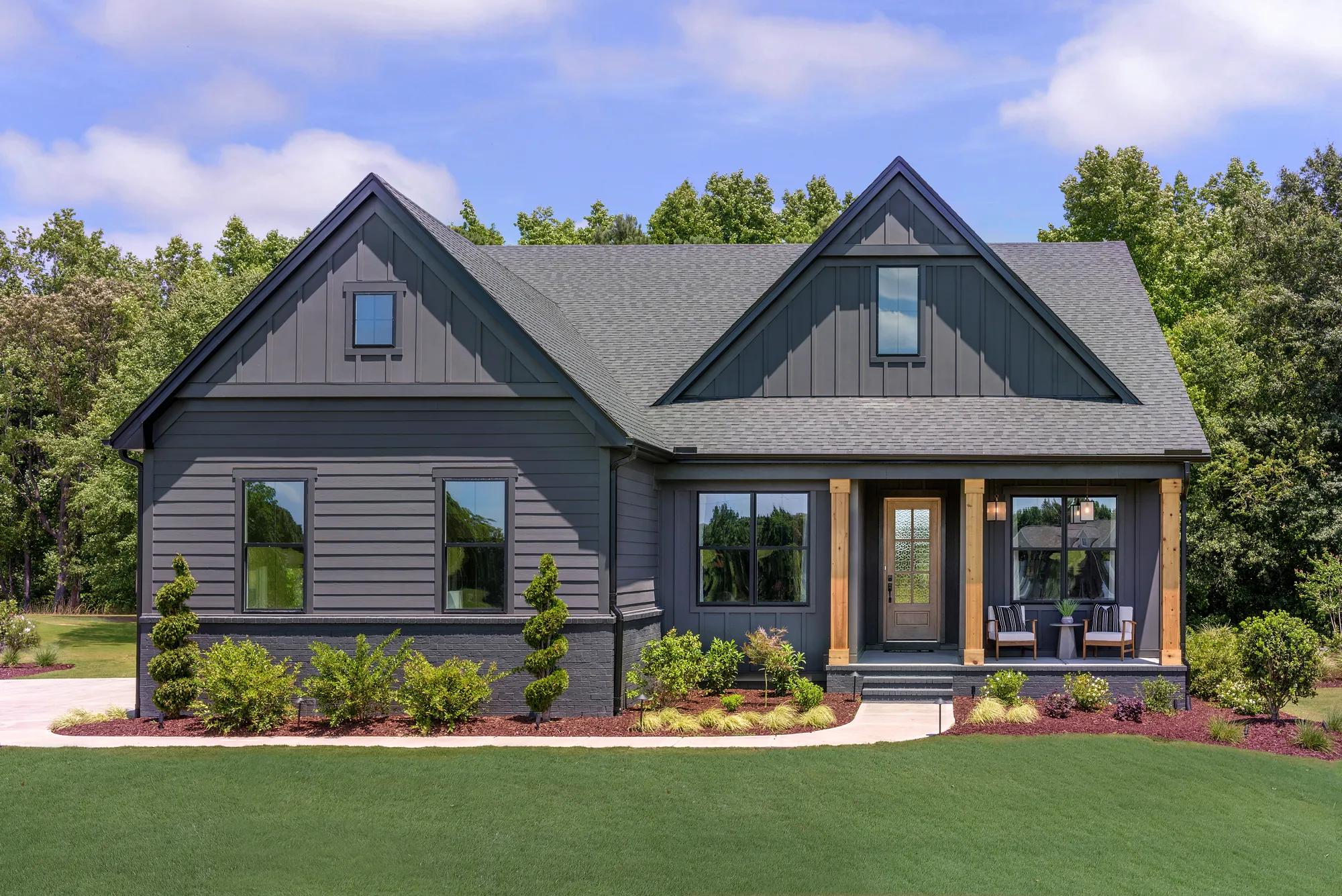 new custom home with dark exterior and wood accents