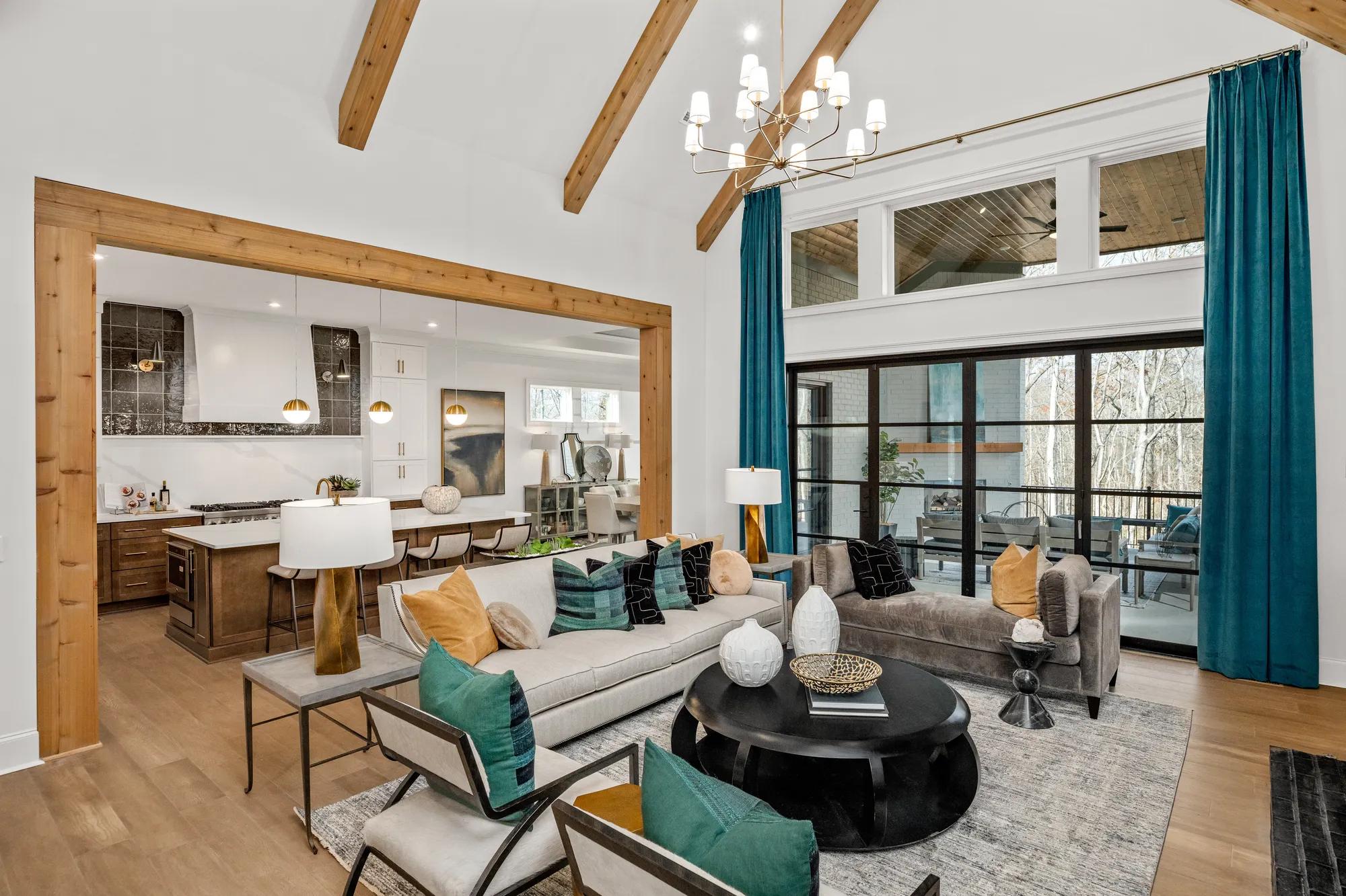 new home family room with french doors to outdoor living area