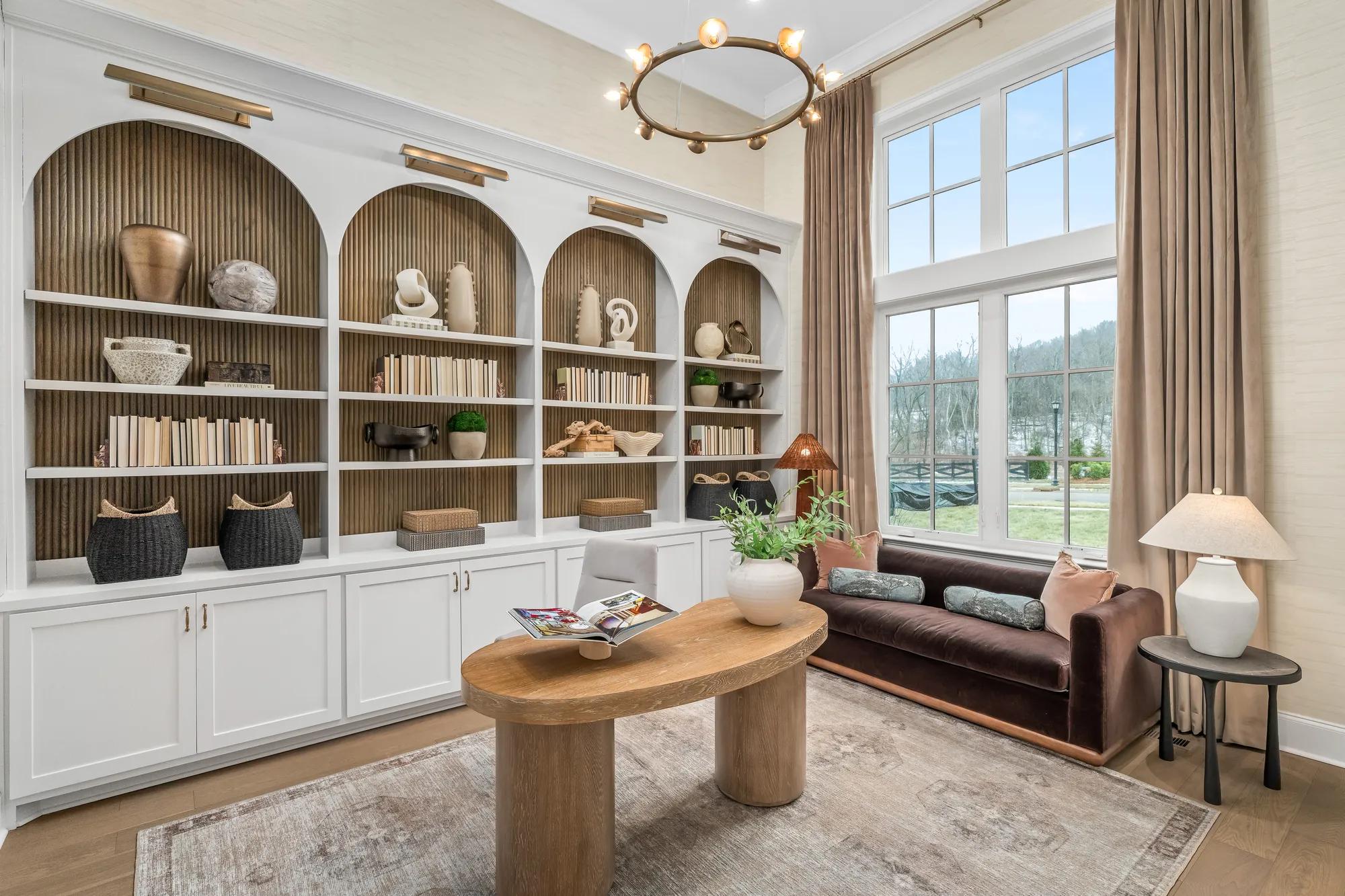 Custom home office with built in shelves and cabinets