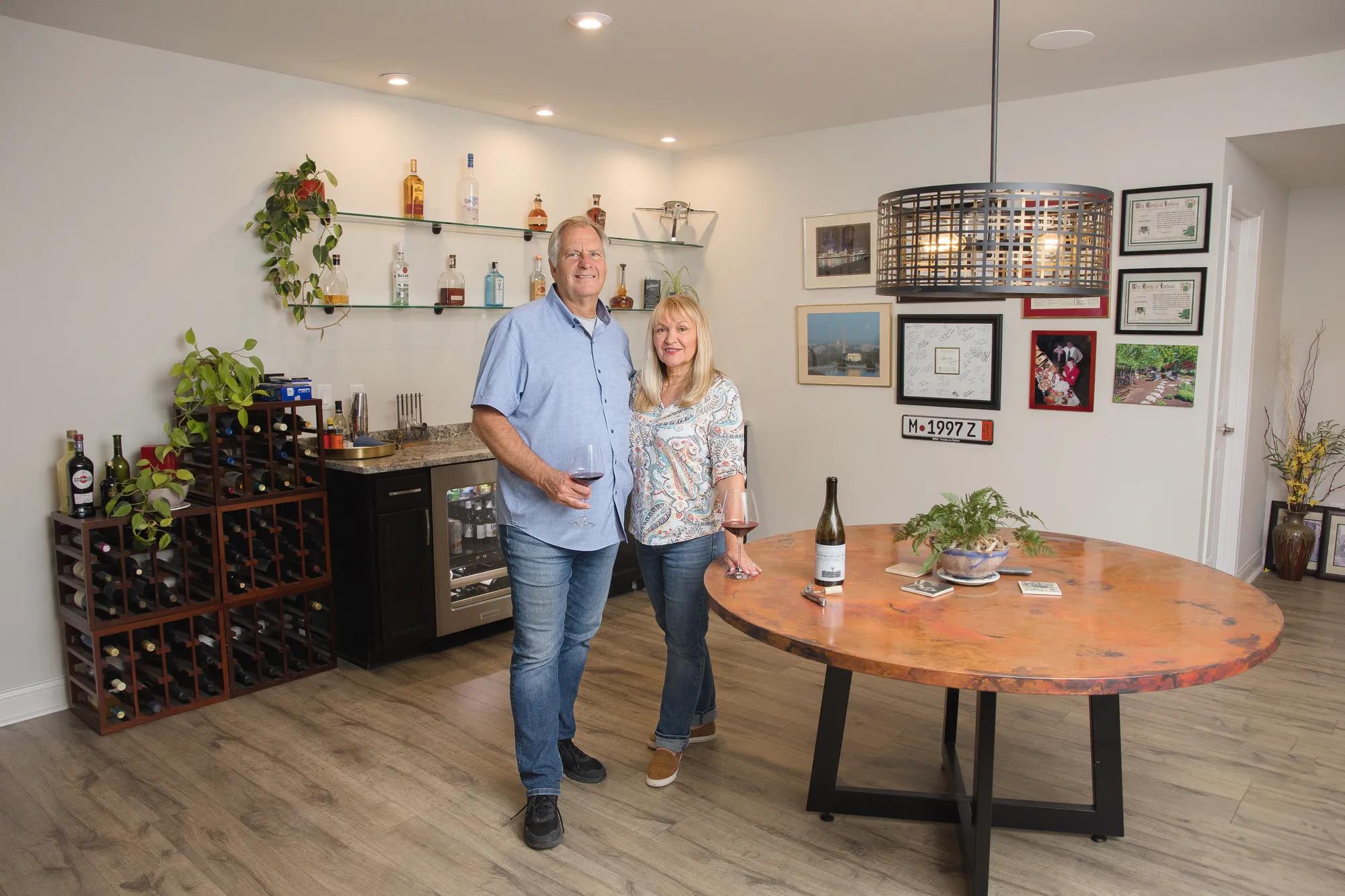 New homeowners standing in front of a wine bar