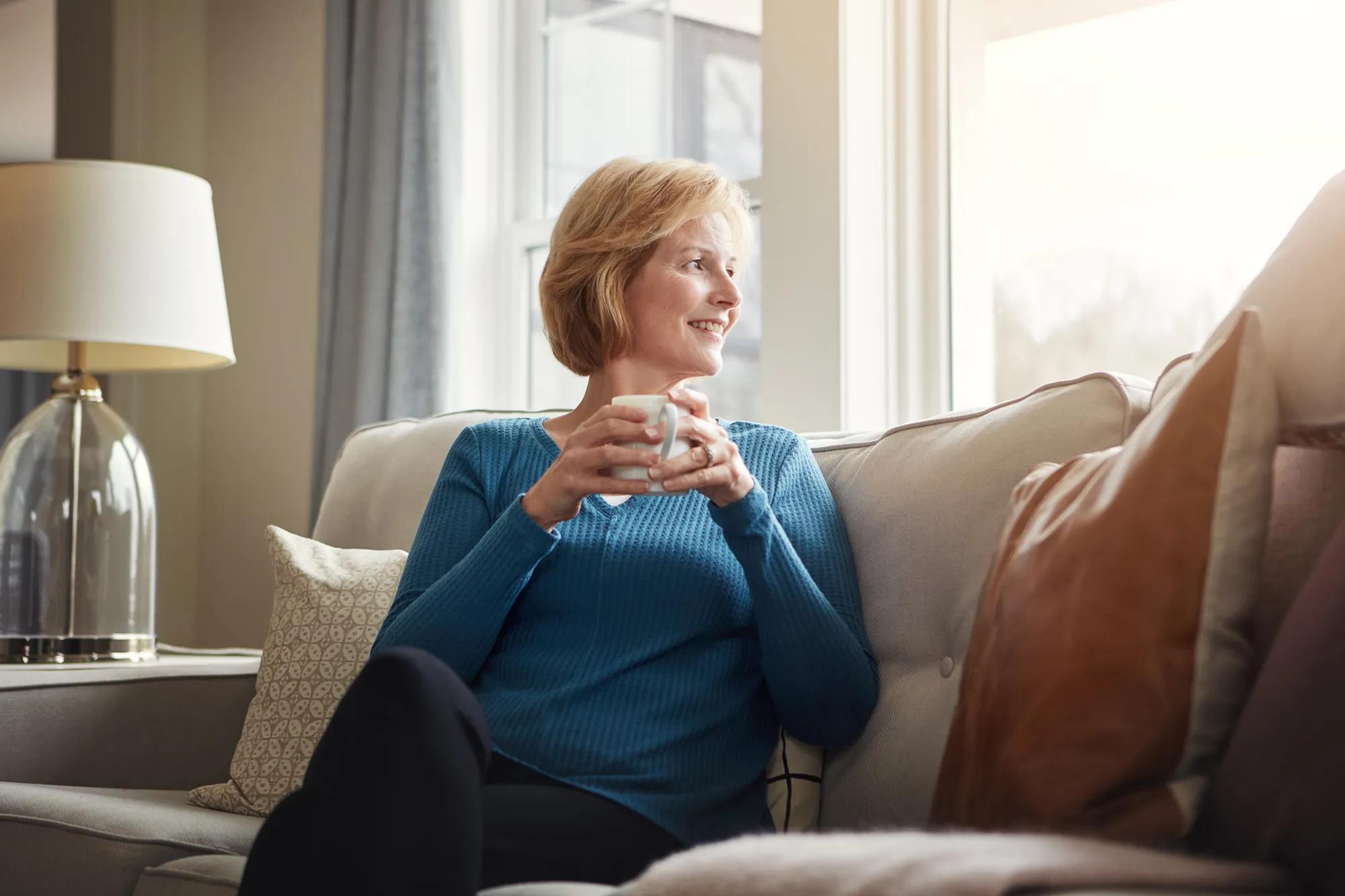 Woman enjoying coffee at home