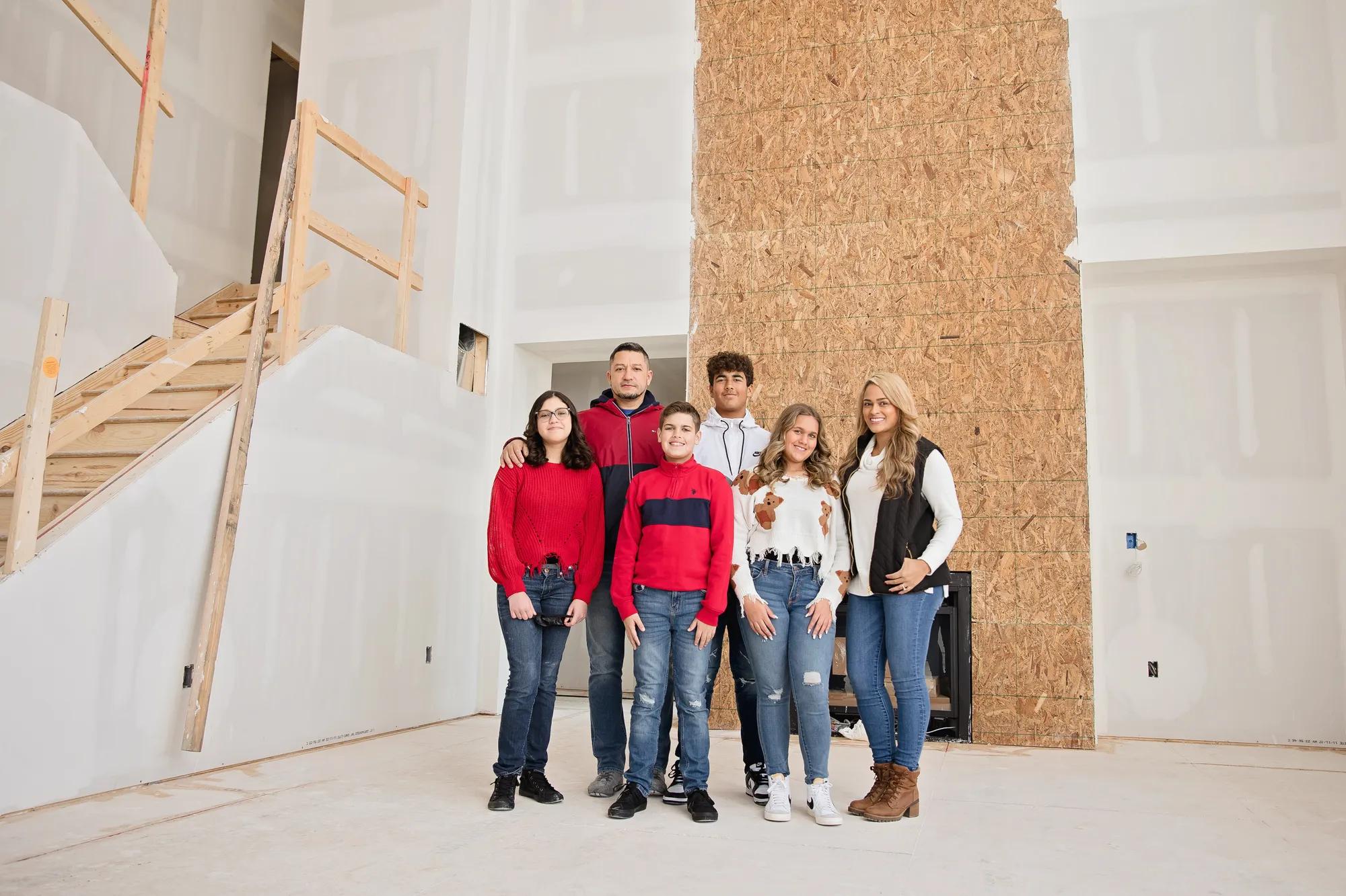 New homeowners inside of their future home