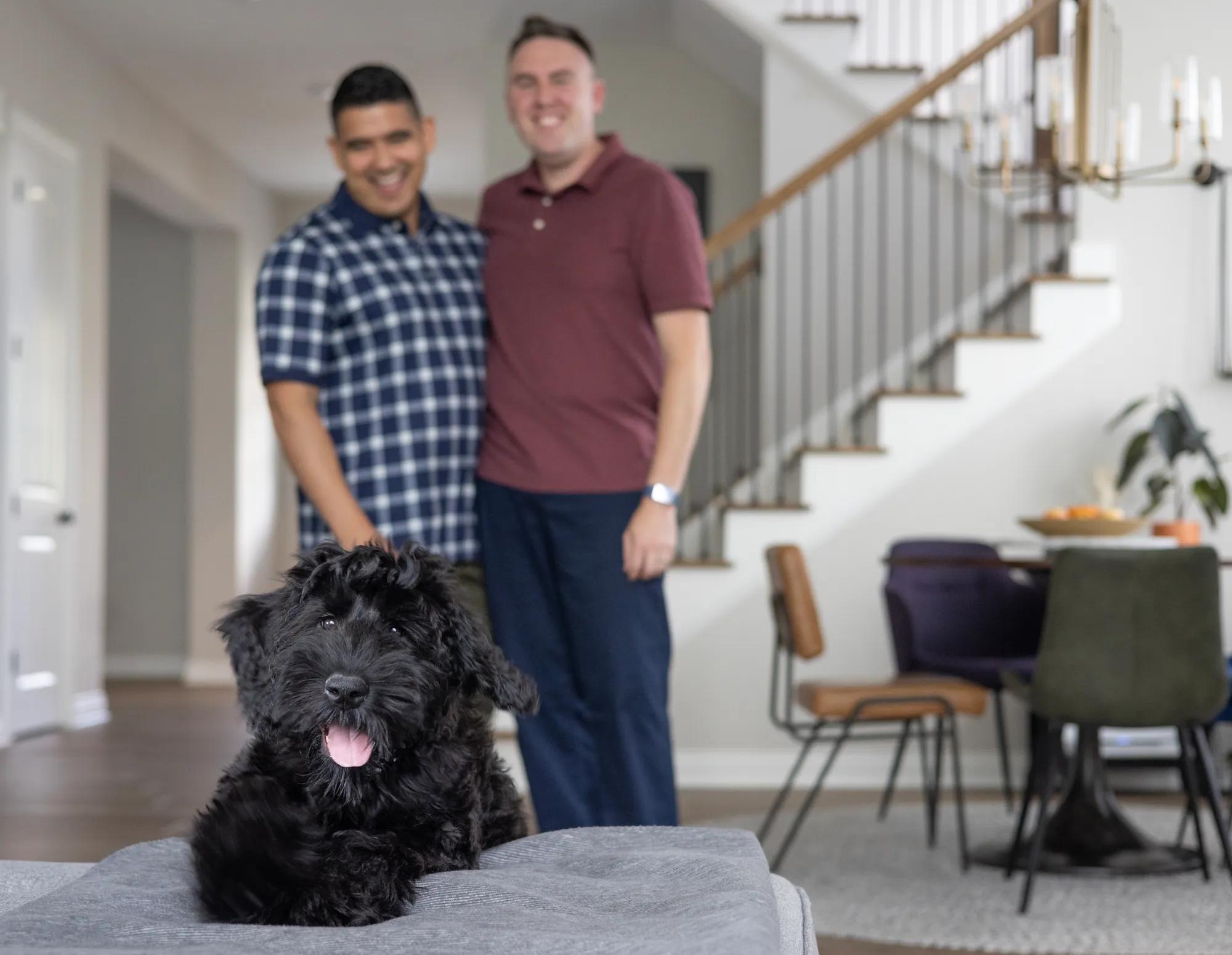 Couple with dog enjoying new home
