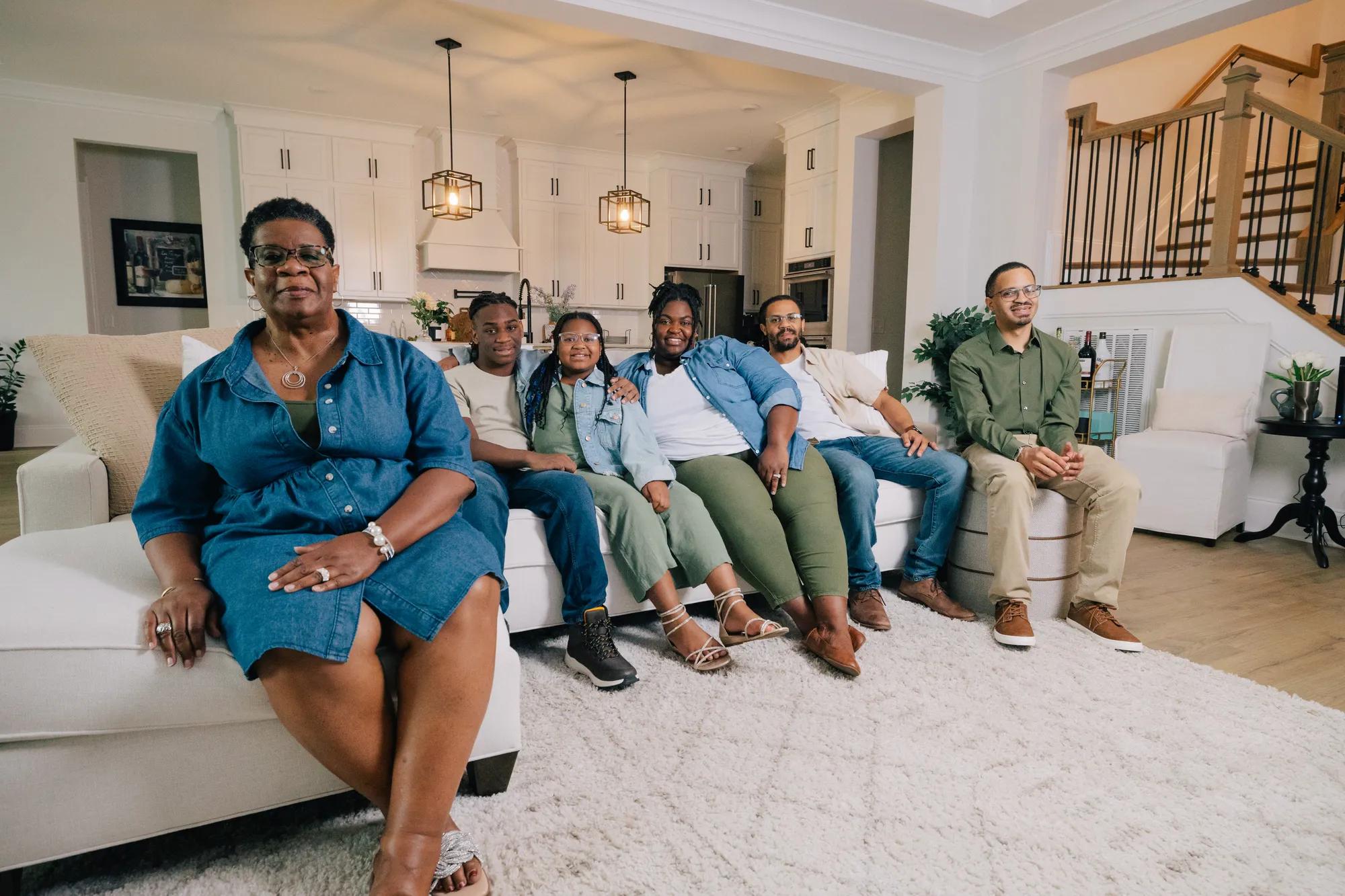 New homeowners relaxing in their beautiful Drees Home family room