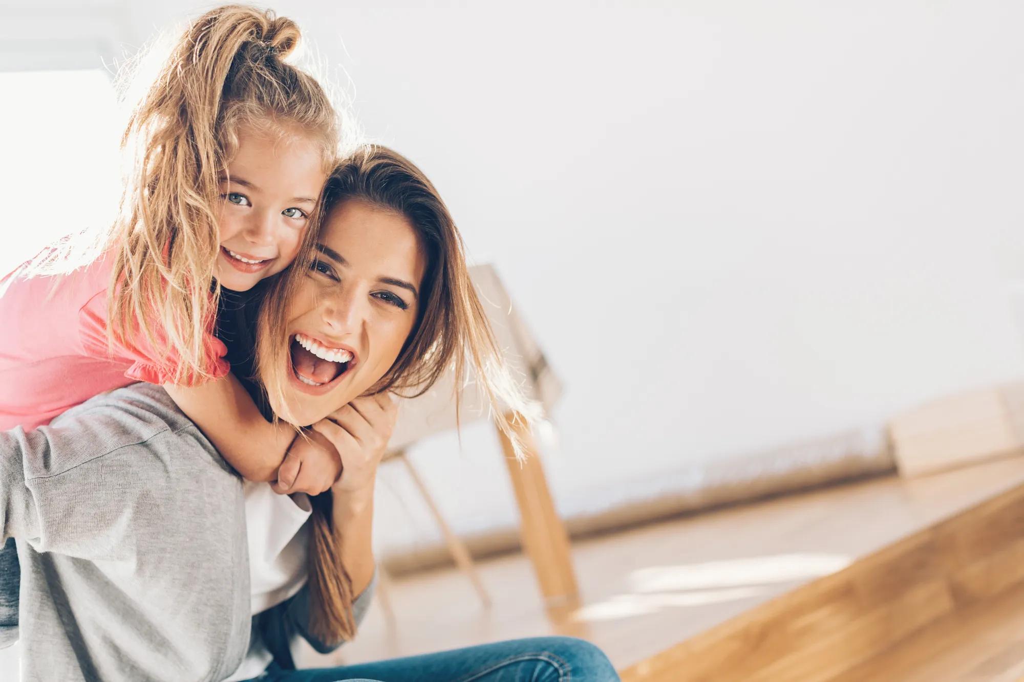 Mother and daughter enjoying new home