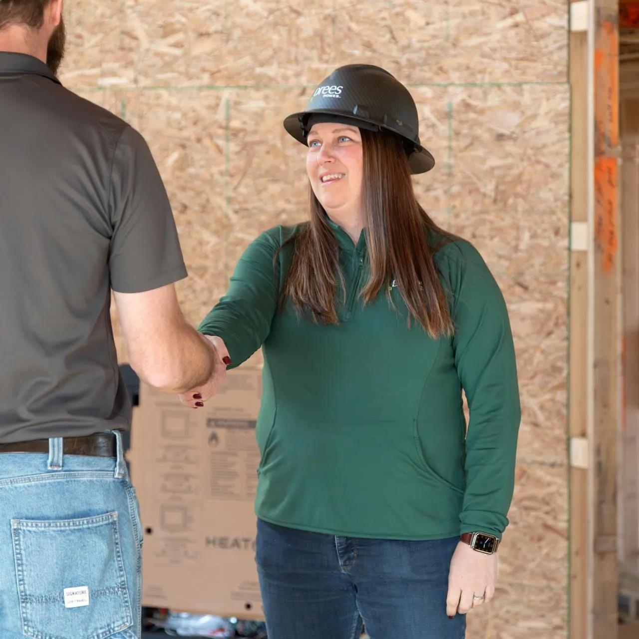 Shaking hands at construction site