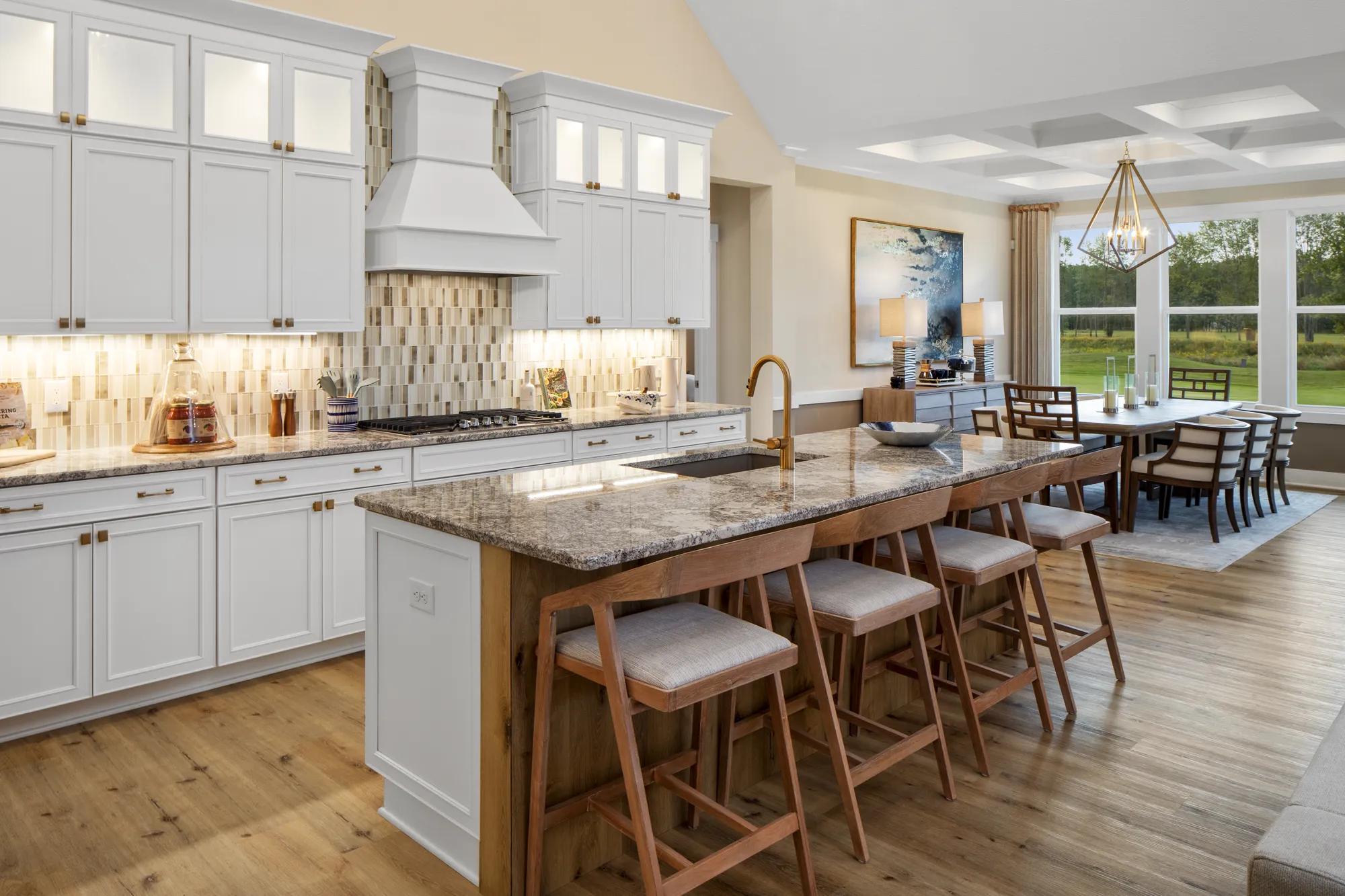 kitchen with white cabinets and tile backsplash