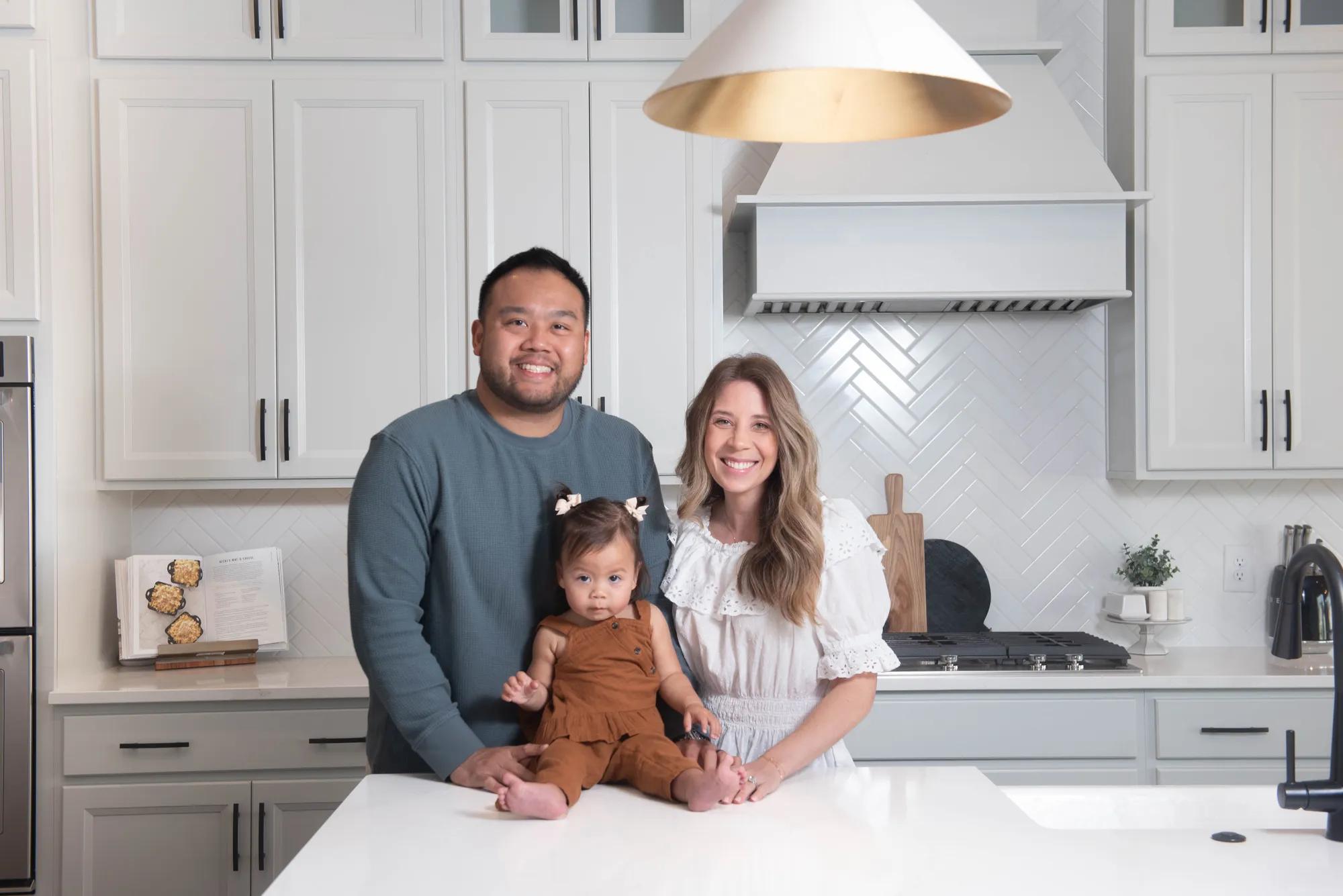 New homeowners in their beautiful bright kitchen