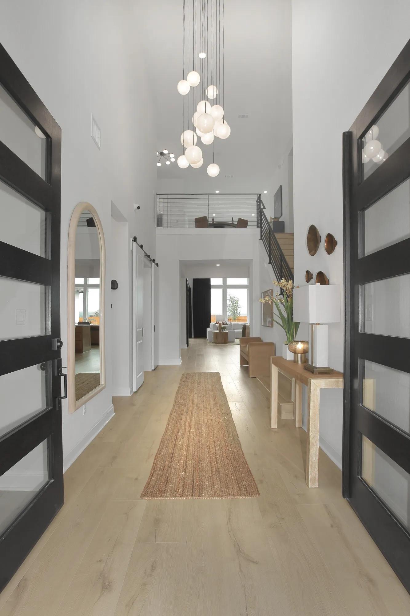 Custom home double front door entrance two-story foyer