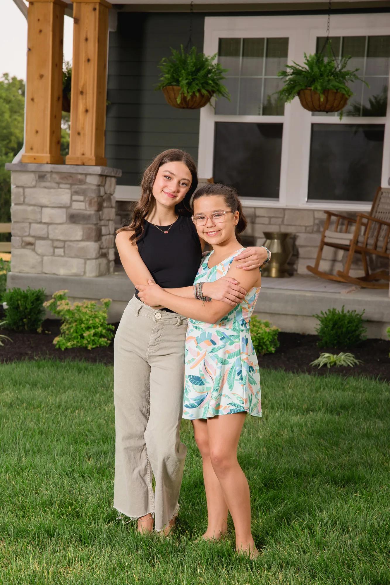 New homeowners outside of their Alden home