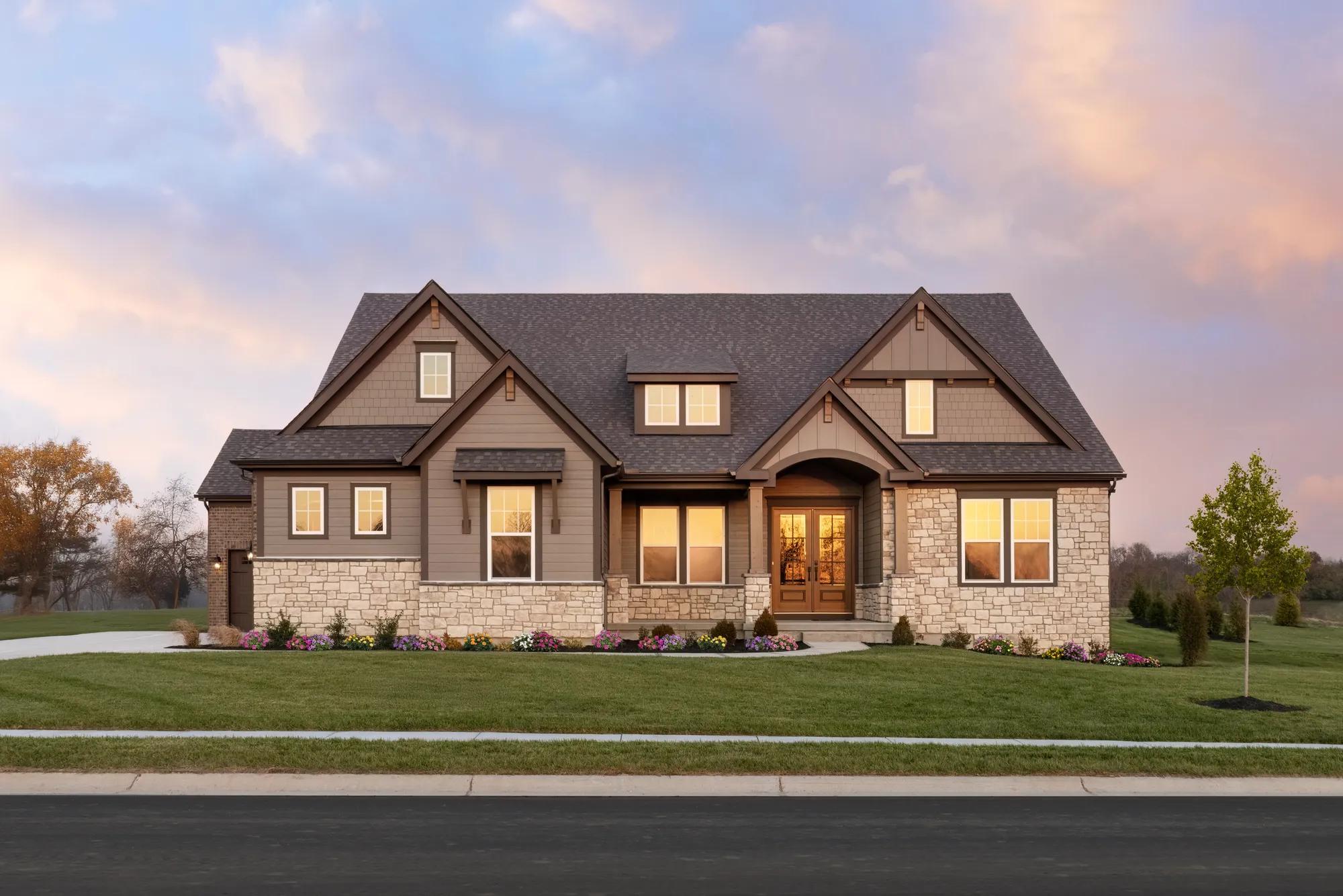 custom home with stone and siding exterior