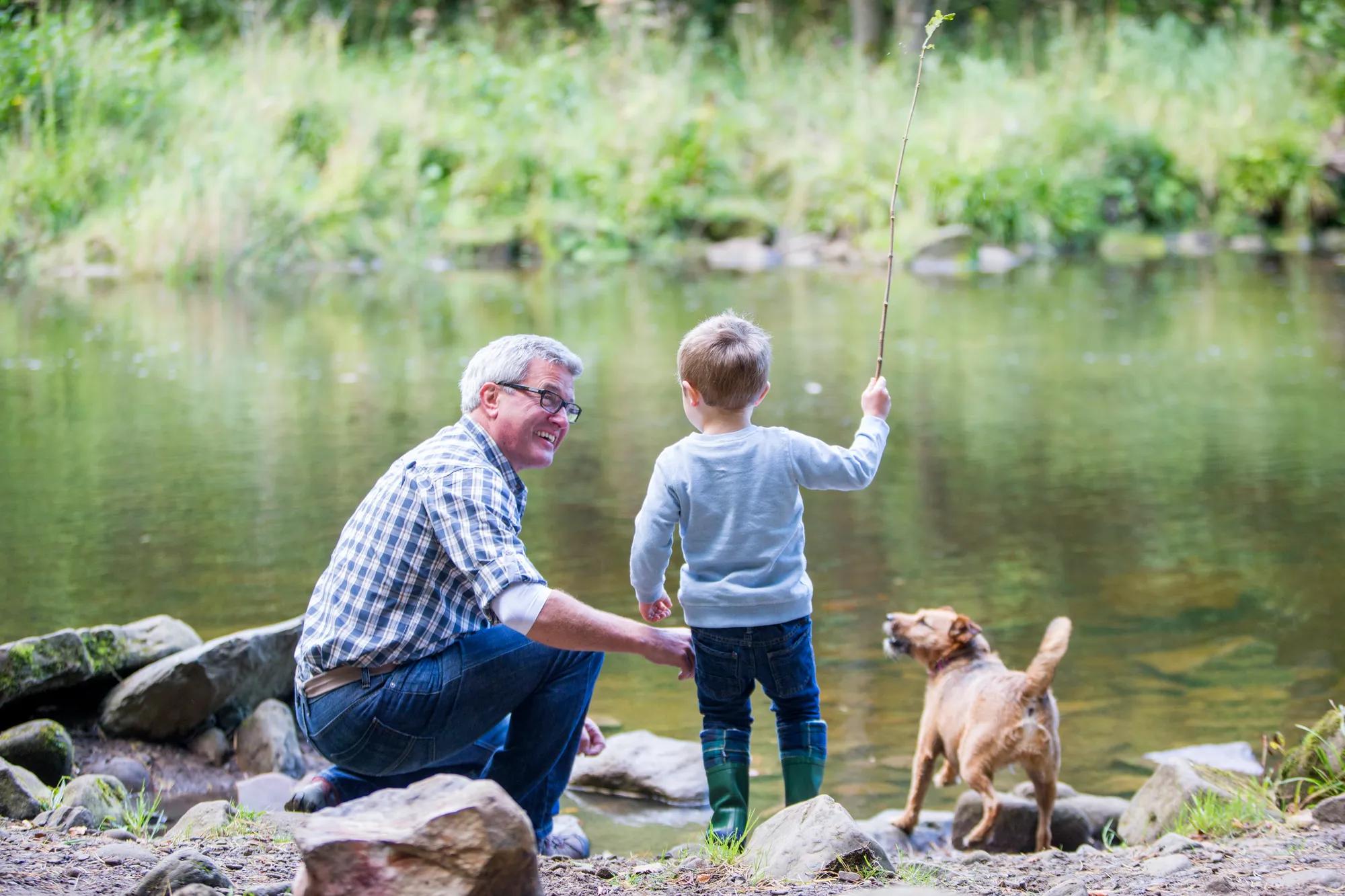 Grandfather and grandson fishing