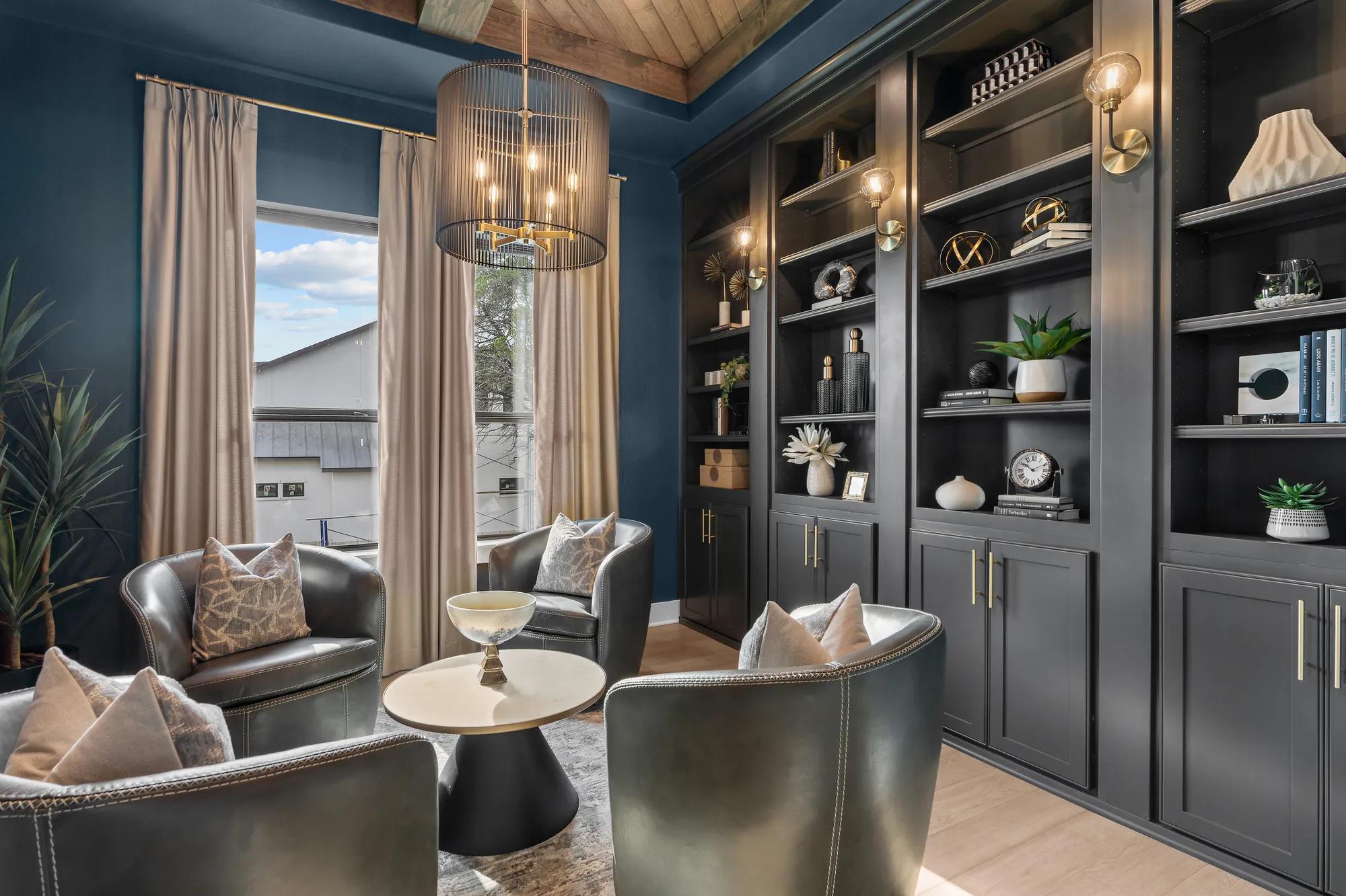 New home office with dark blue walls and wooden panel ceiling accent
