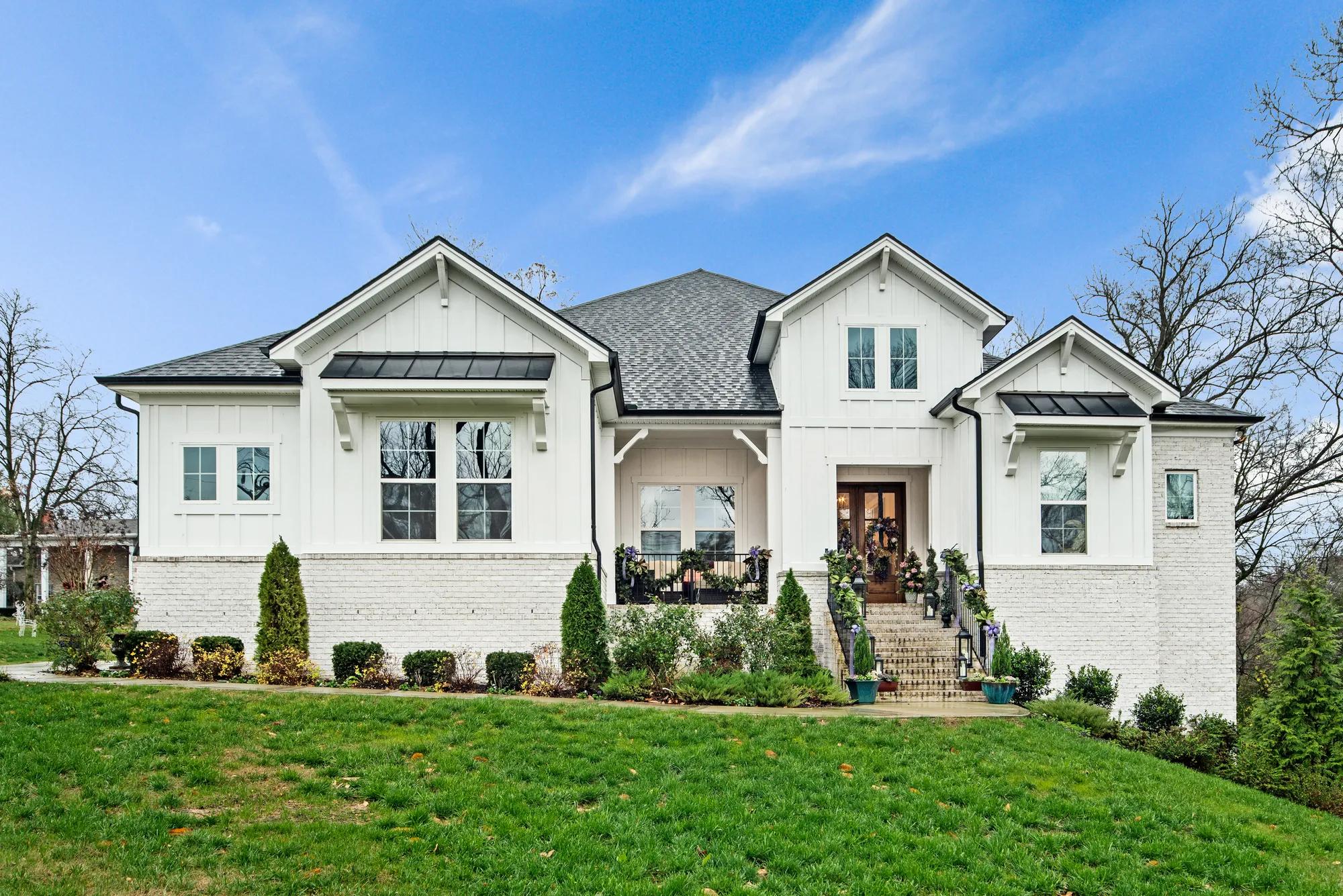 new custom home exterior decorated for the holidays