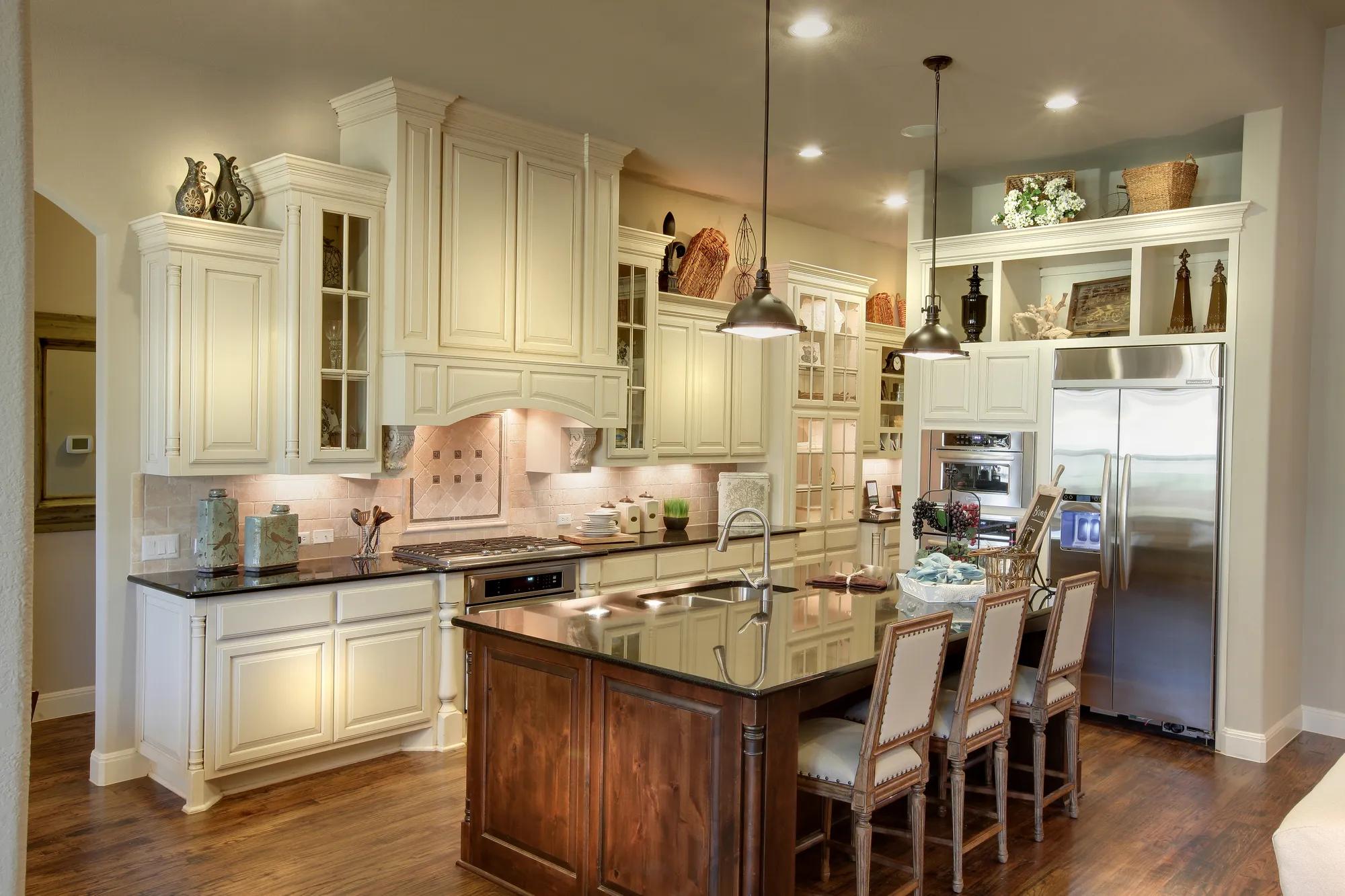 New home kitchen with two toned cabinets and large serving island